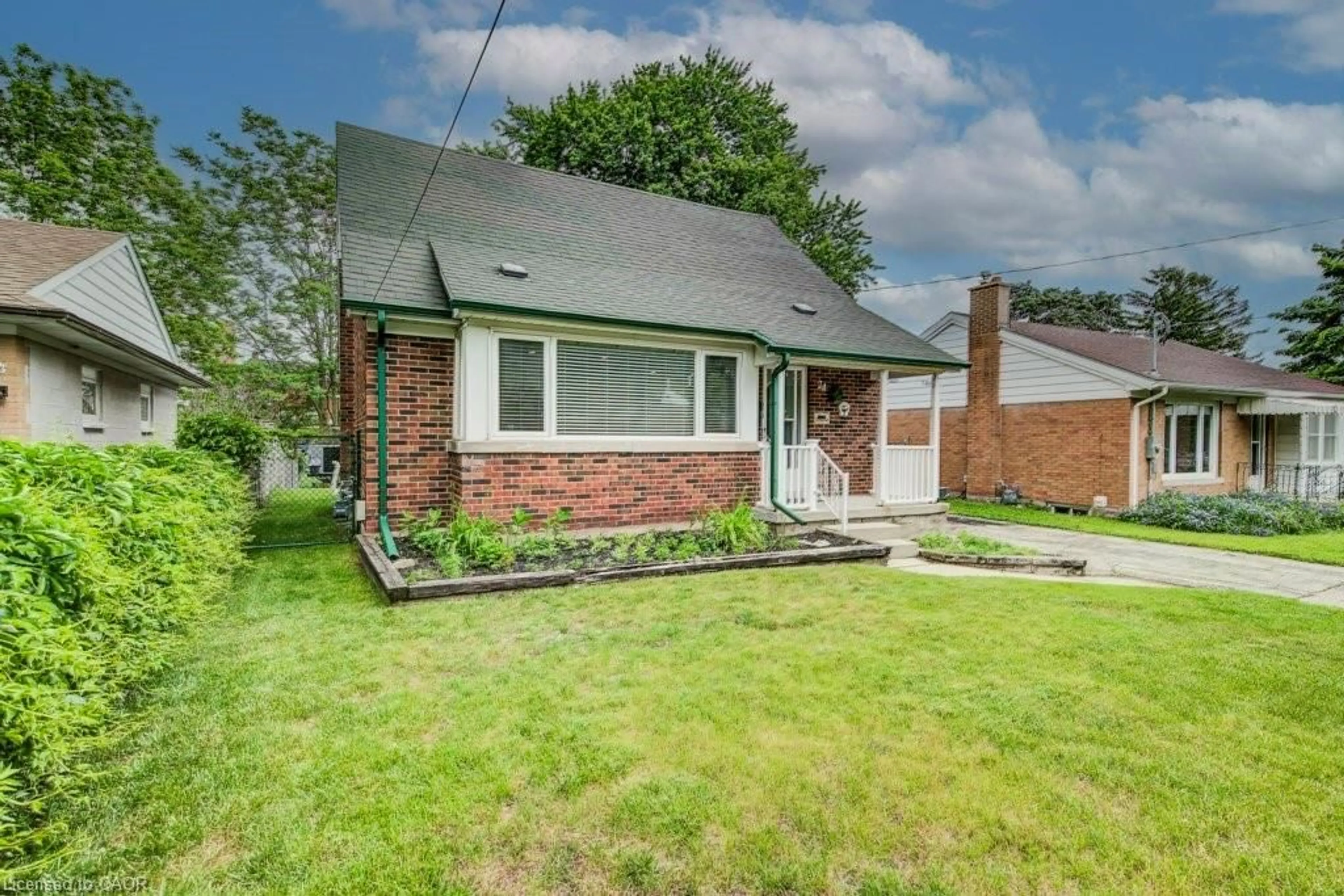 Home with brick exterior material, street for 24 Belmont Ave, Kitchener Ontario N2M 4B9