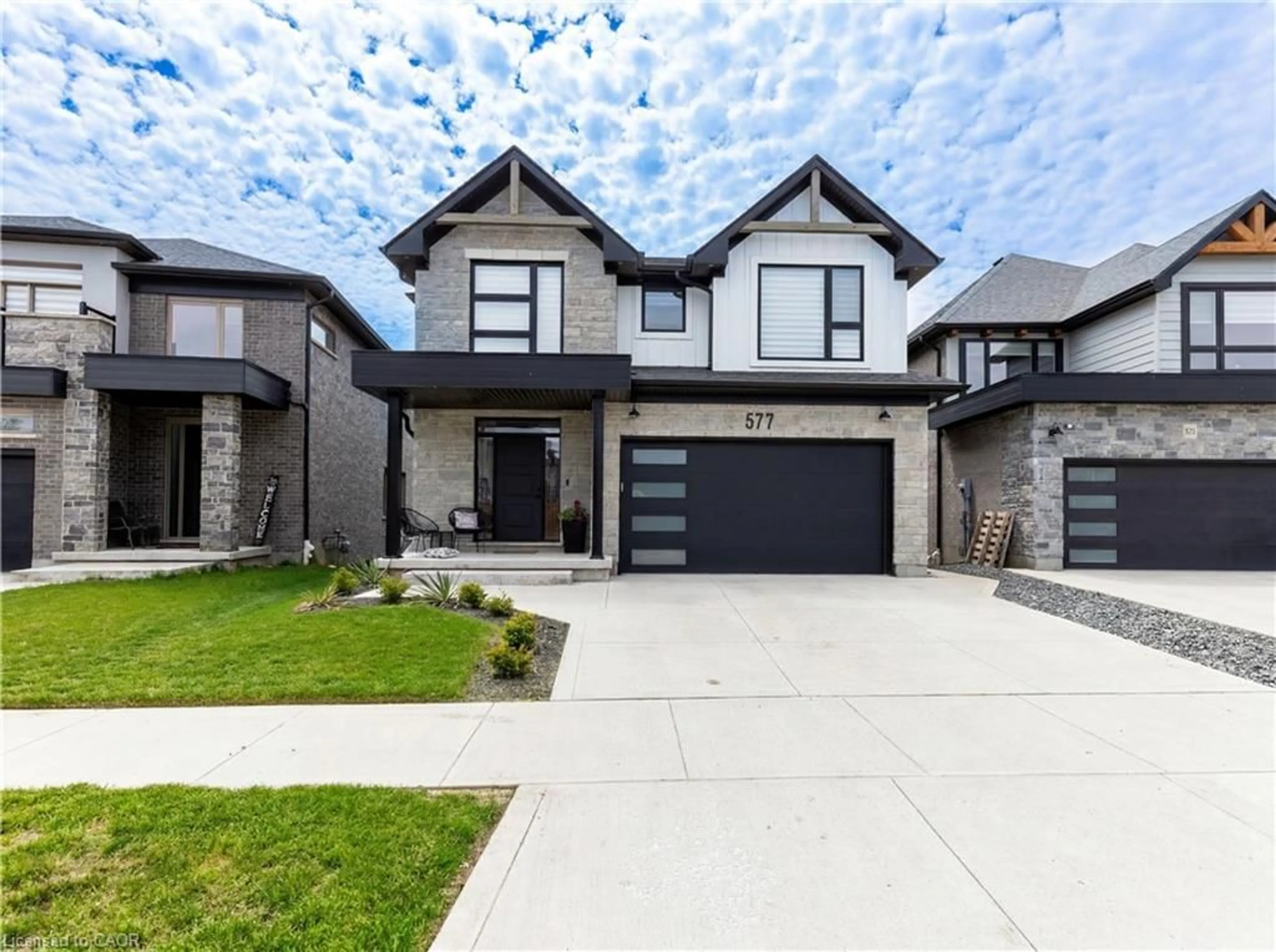 Home with brick exterior material, street for 577 Doonwoods Cres, Kitchener Ontario N2P 0E5