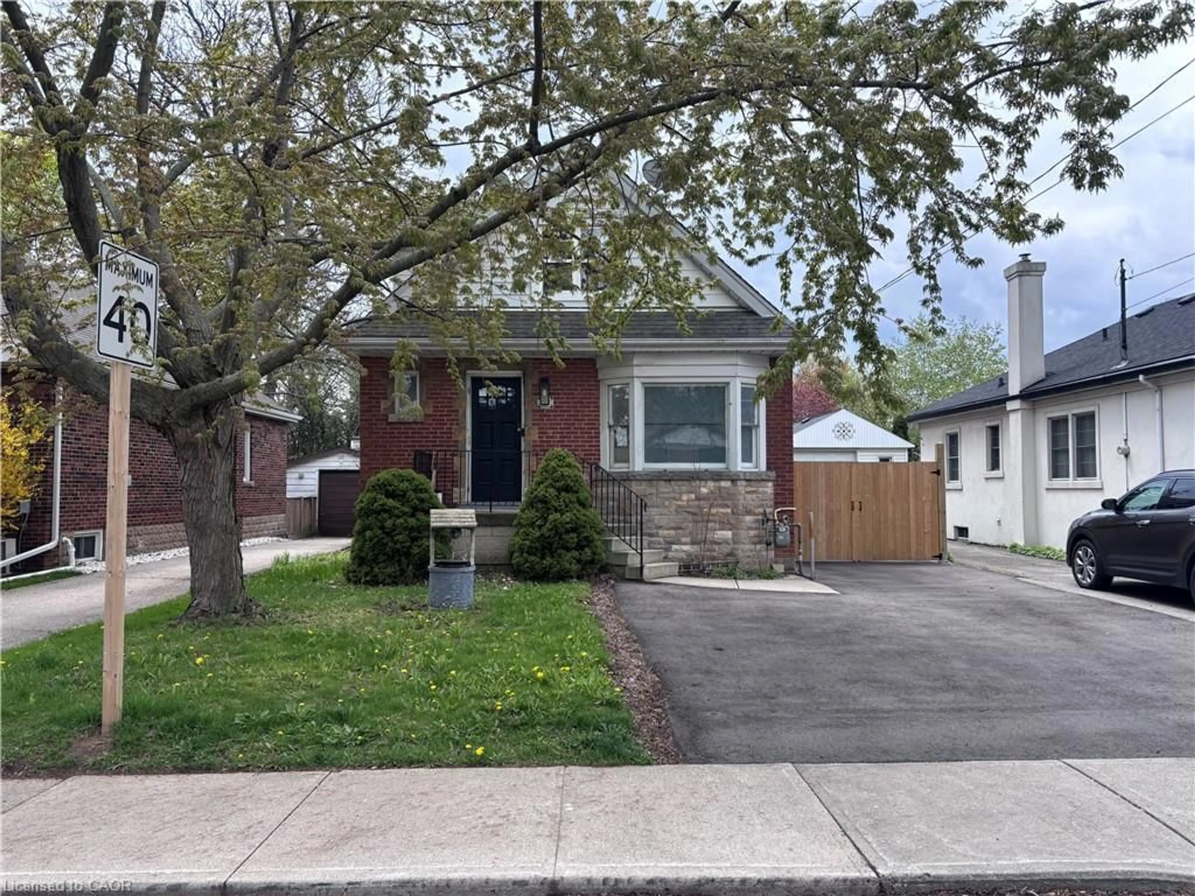 Home with brick exterior material, street for 122 Queensdale Ave, Hamilton Ontario L9A 1K3
