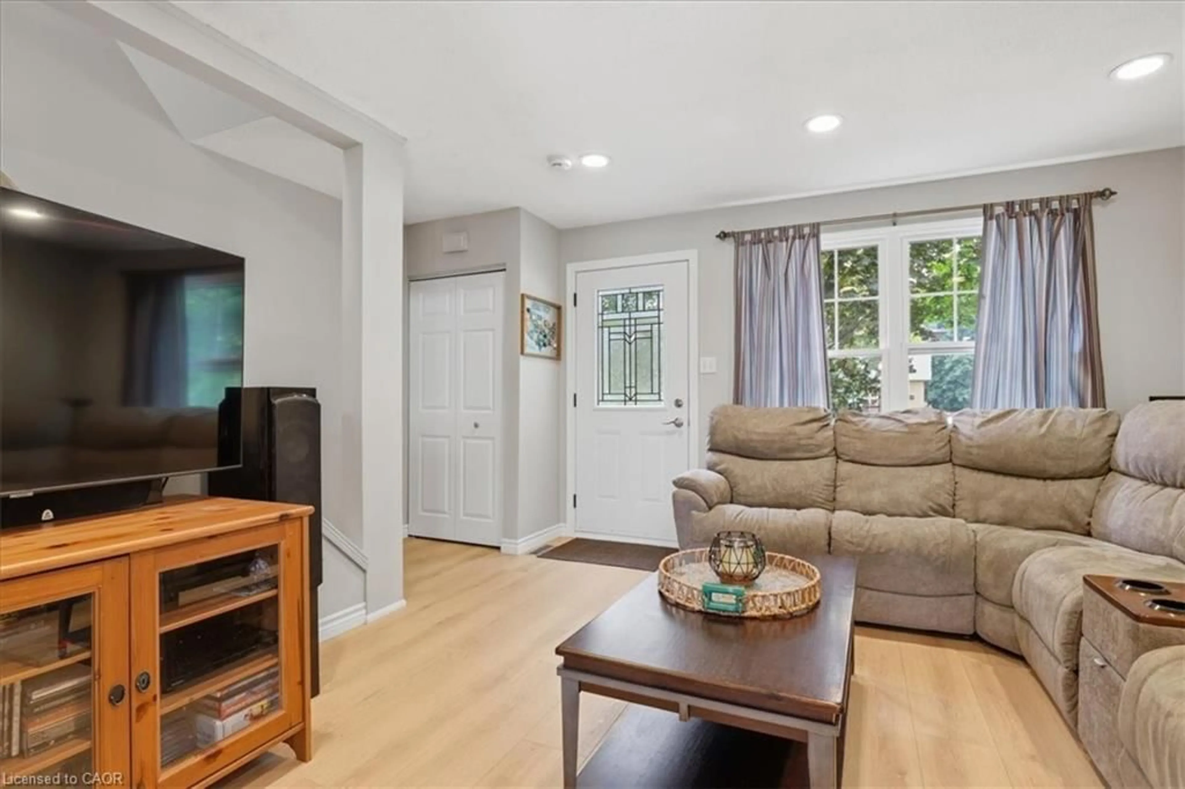 Living room with furniture, wood/laminate floor for 116 Scott Rd, Cambridge Ontario N3C 2X8