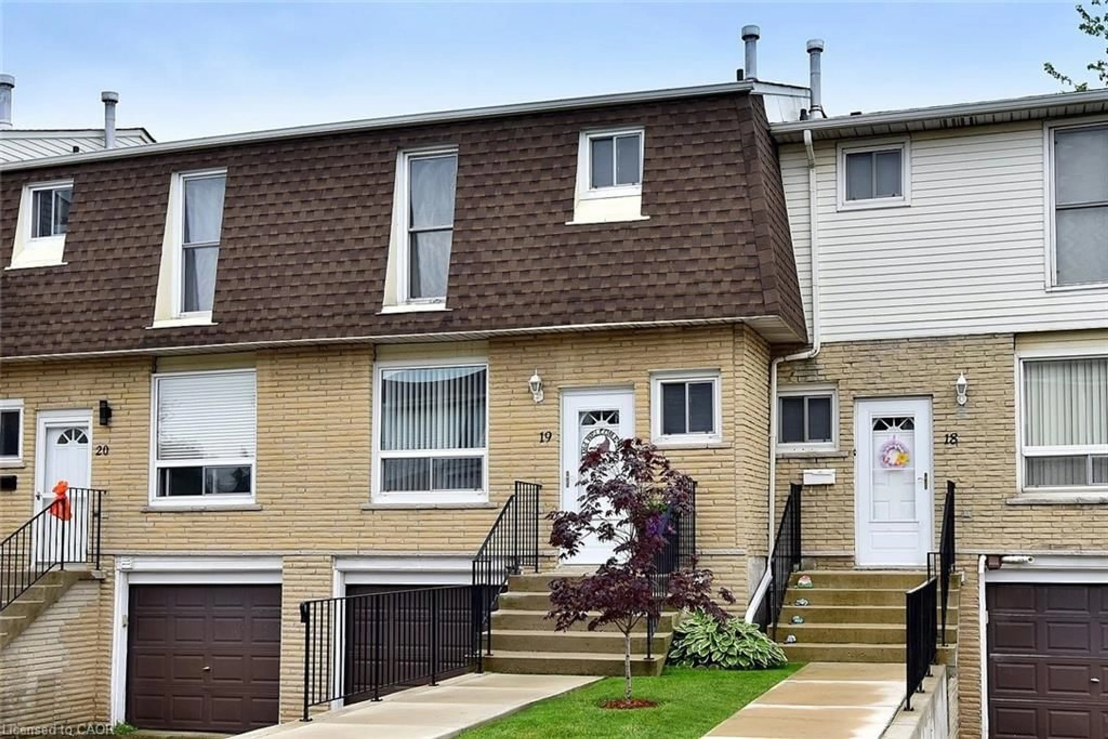 Home with vinyl exterior material, street for 1338 Upper Gage Ave #19, Hamilton Ontario L8W 1N2