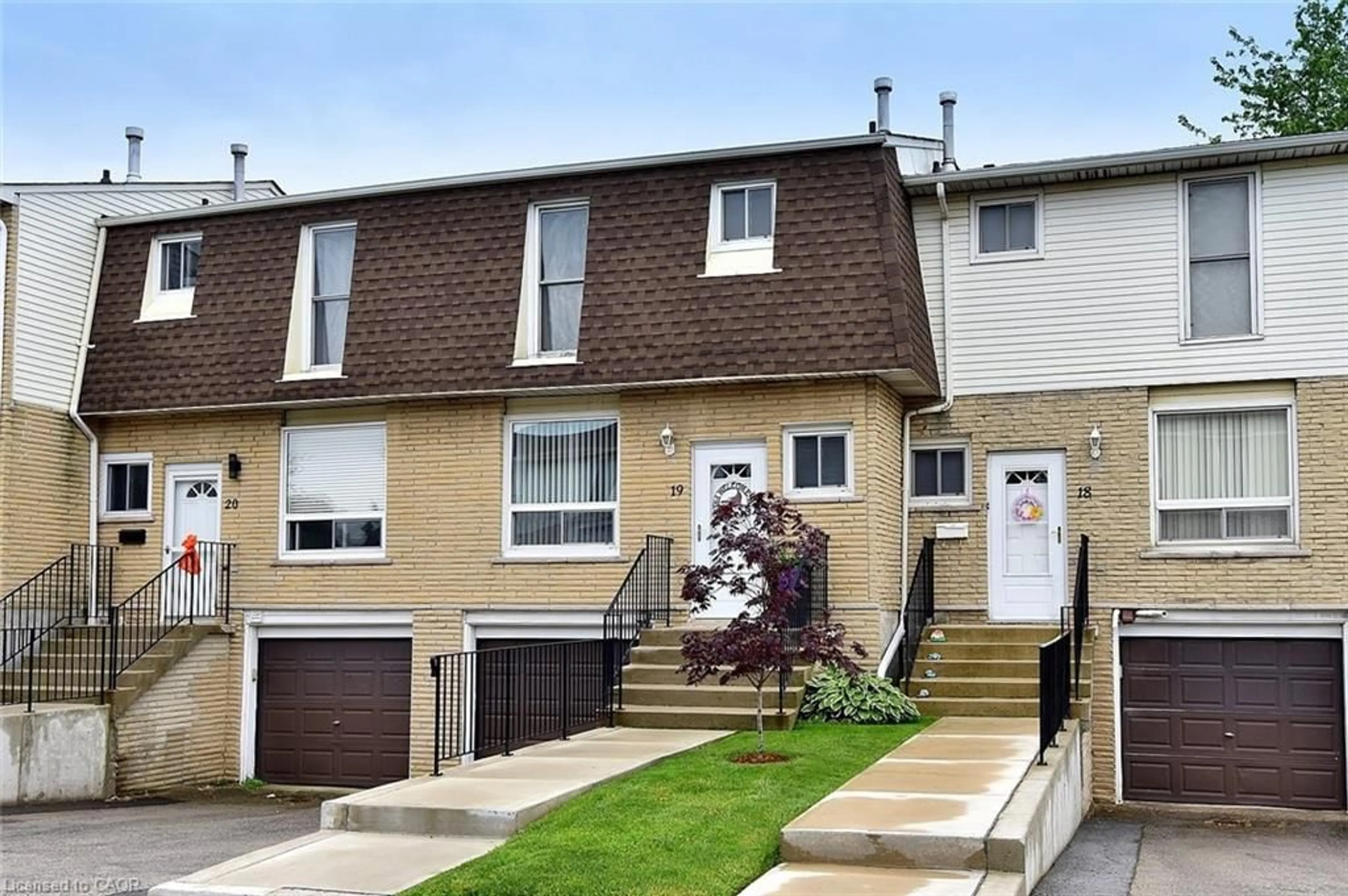 Home with vinyl exterior material, street for 1338 Upper Gage Ave #19, Hamilton Ontario L8W 1N2