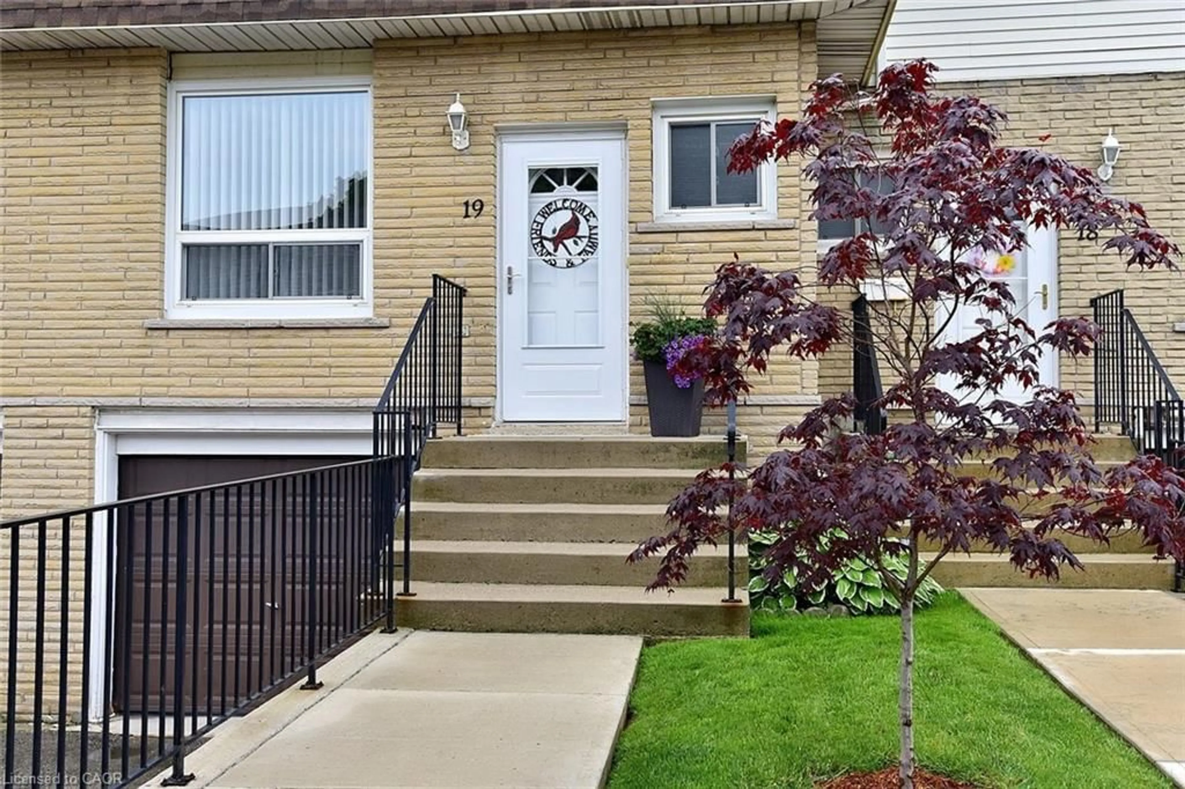 Home with vinyl exterior material, street for 1338 Upper Gage Ave #19, Hamilton Ontario L8W 1N2