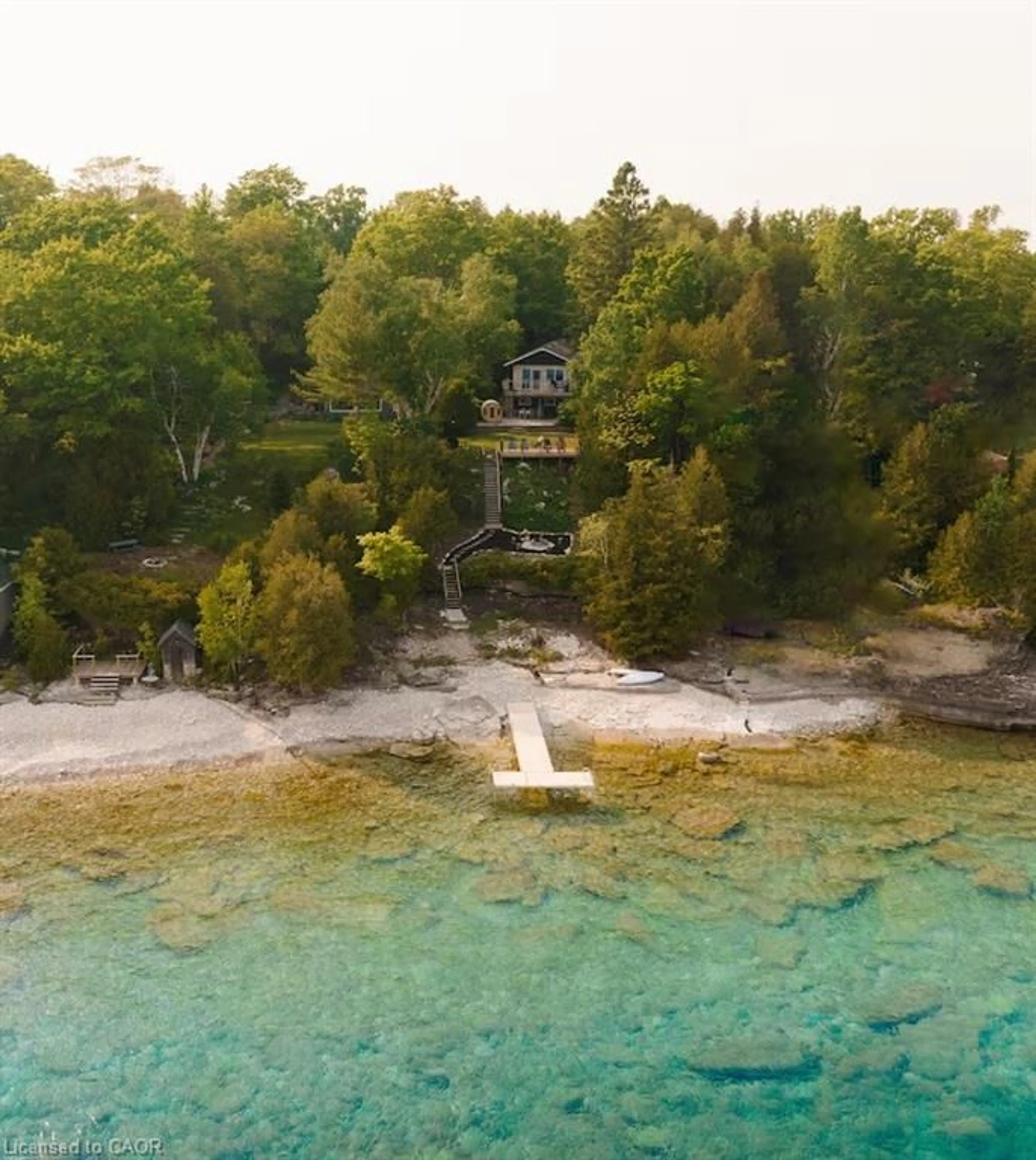 A pic from outside/outdoor area/front of a property/back of a property/a pic from drone, water/lake/river/ocean view for 46 Whippoorwill Rd, Lions Head Ontario N0H 1W0
