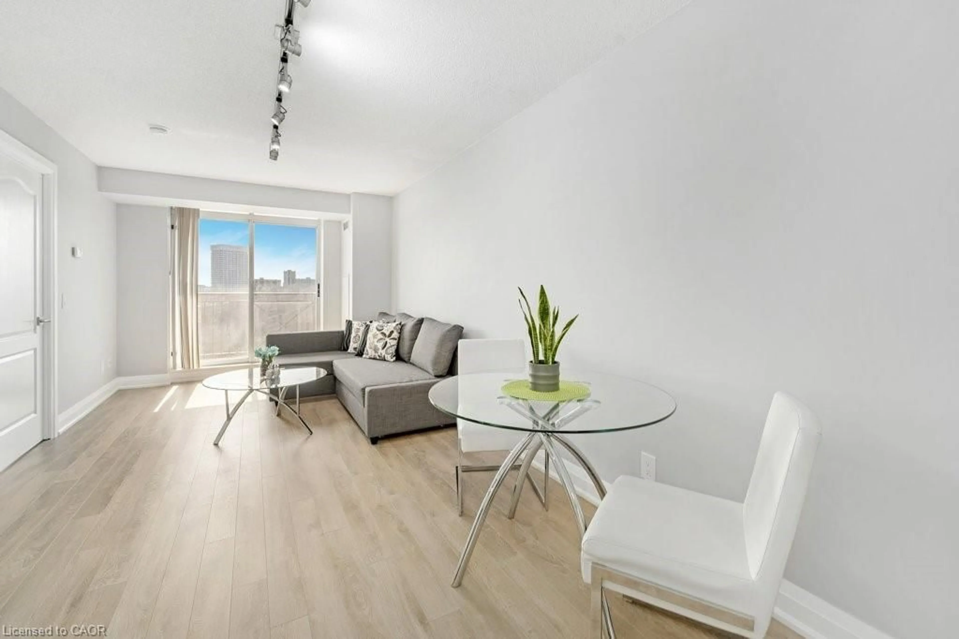 Living room with furniture, wood/laminate floor for 1103 Leslie St #701, North York Ontario M3C 4G8