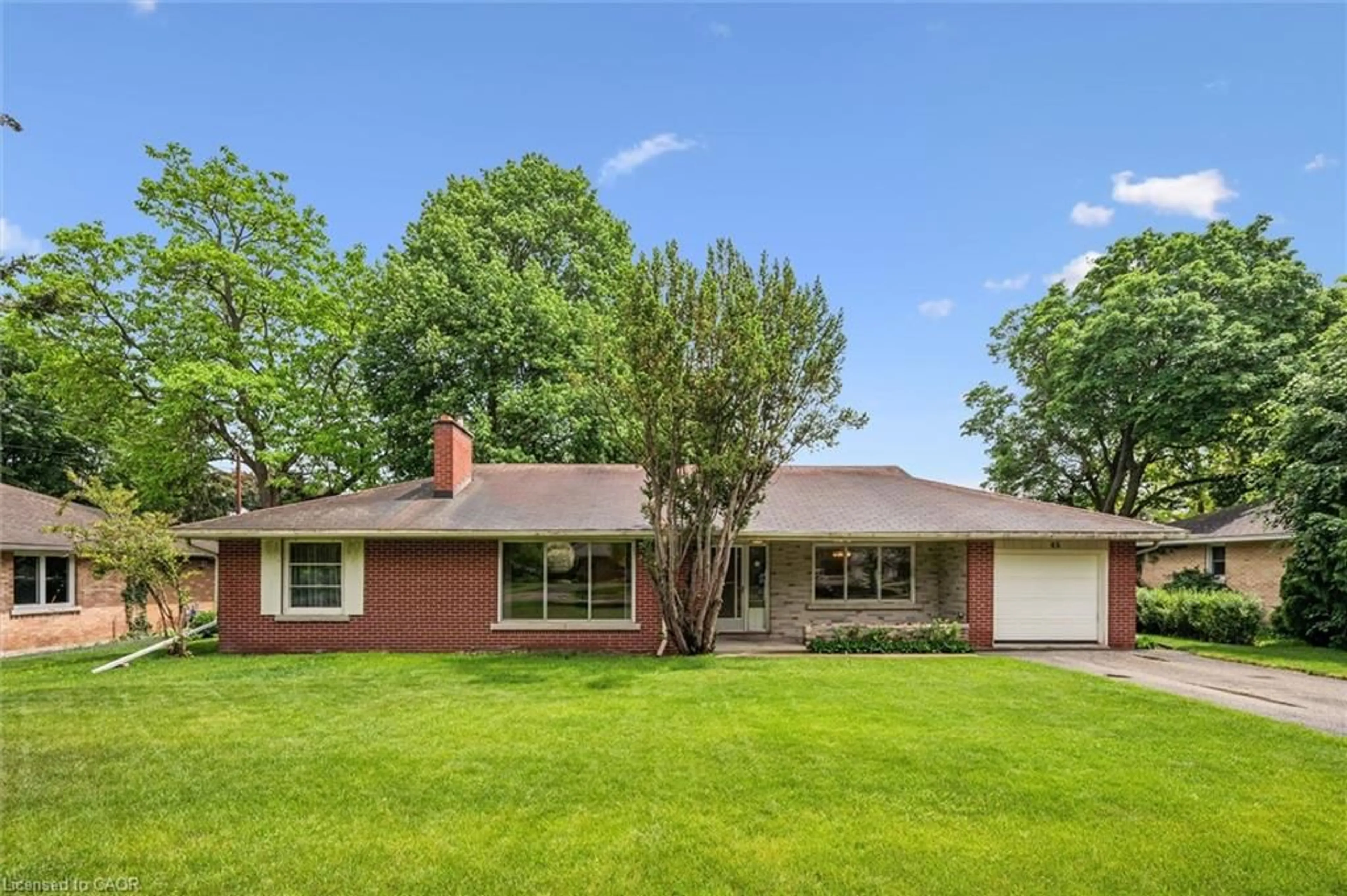 Home with brick exterior material, street for 45 Waverley Dr, Guelph Ontario N1E 1G7