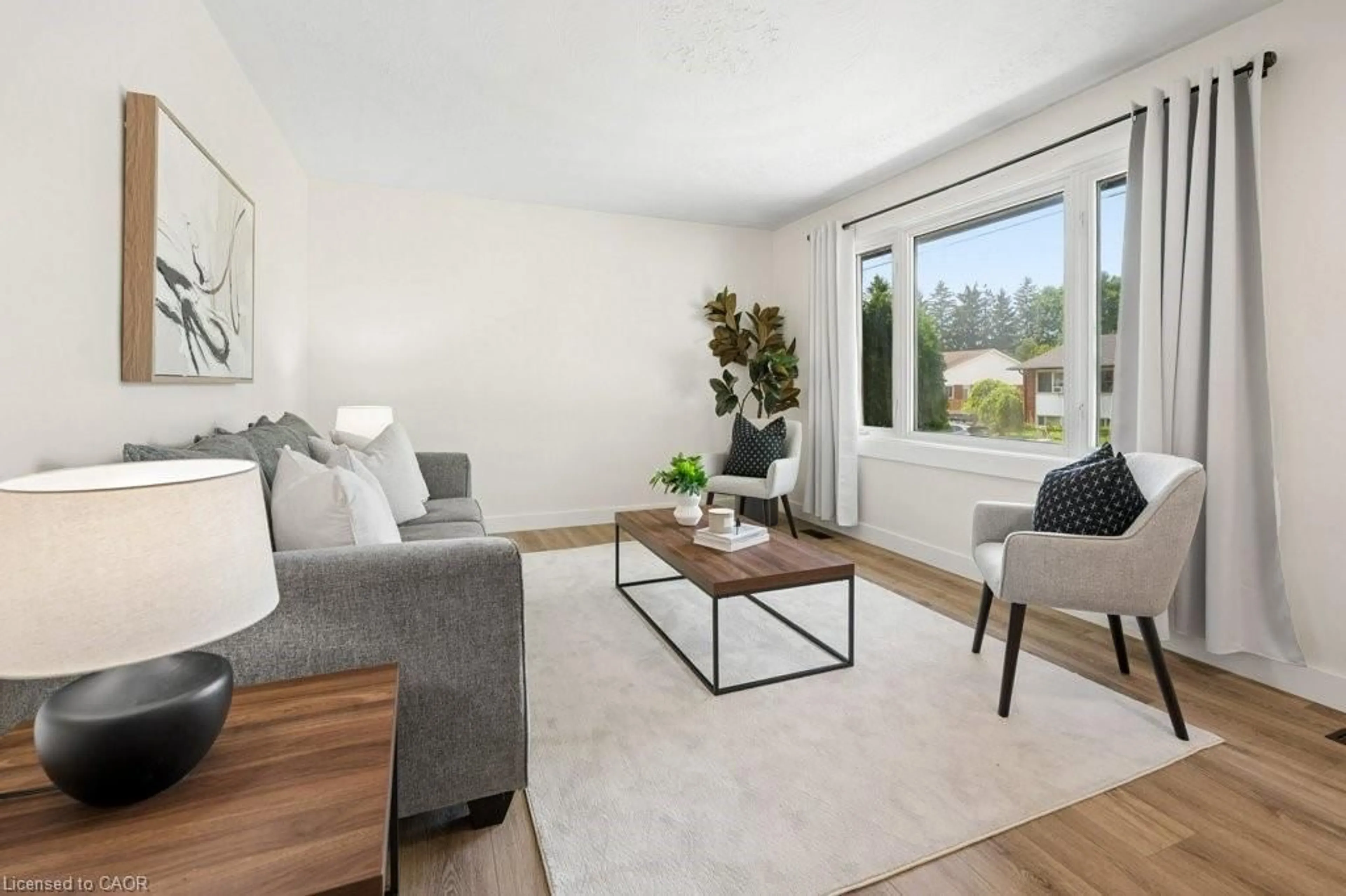 Living room with furniture, wood/laminate floor for 161 East Park Dr, Woodstock Ontario N4S 3N1