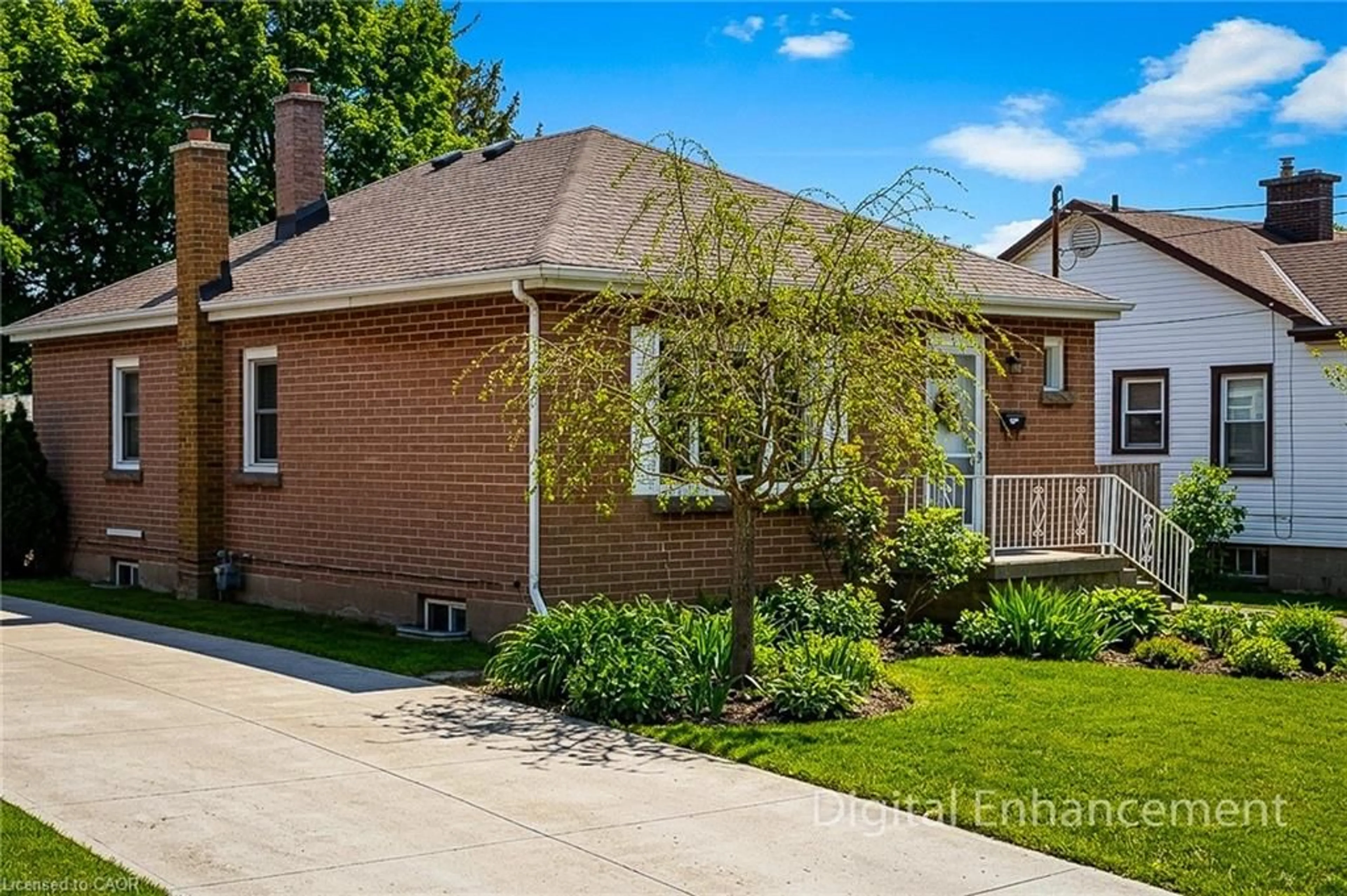 Home with brick exterior material, street for 73 West 1st St, Hamilton Ontario L9C 3C2