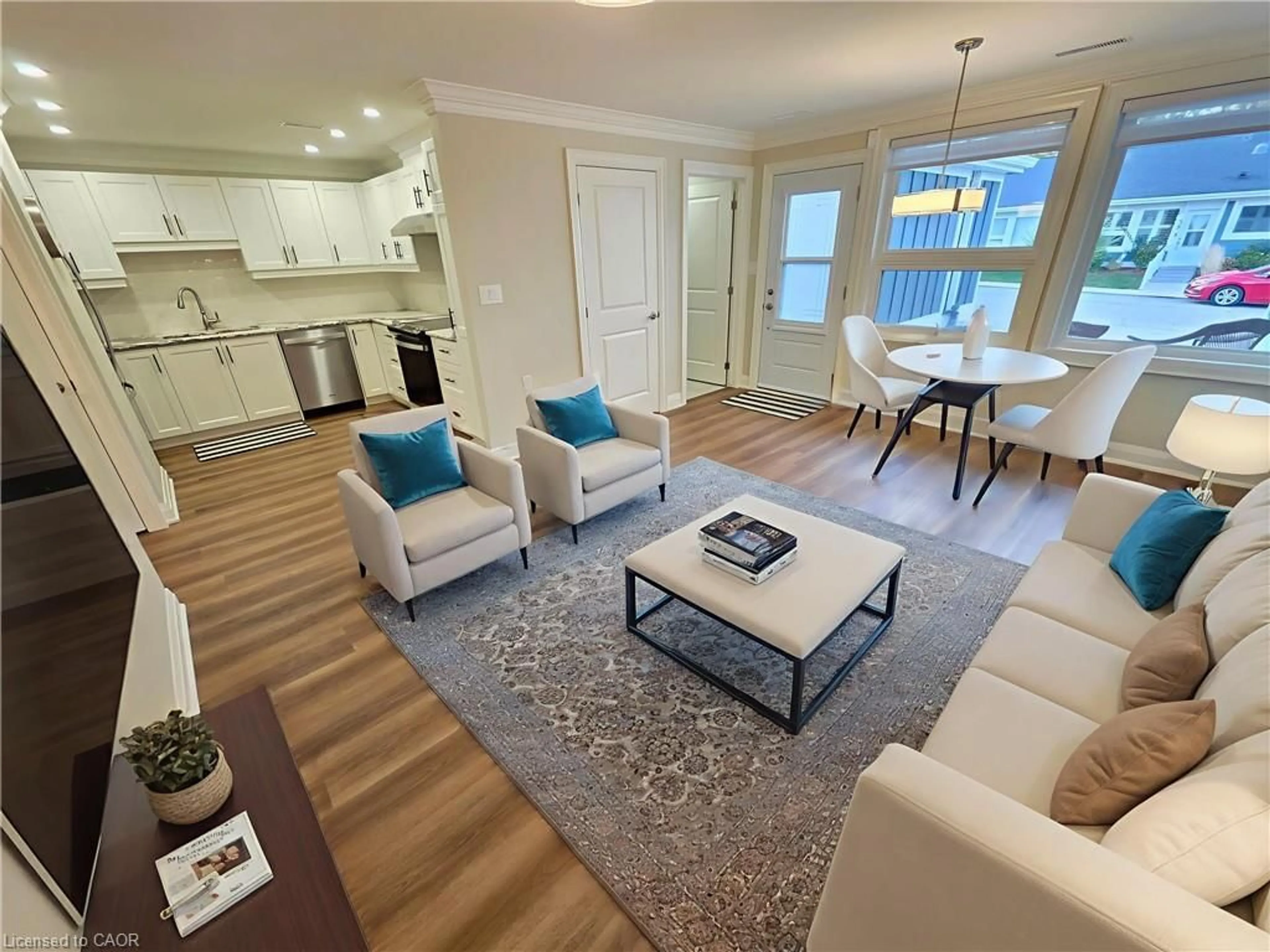 Living room with furniture, wood/laminate floor for 59 Szollosy Cir, Hamilton Ontario L9B 1T8