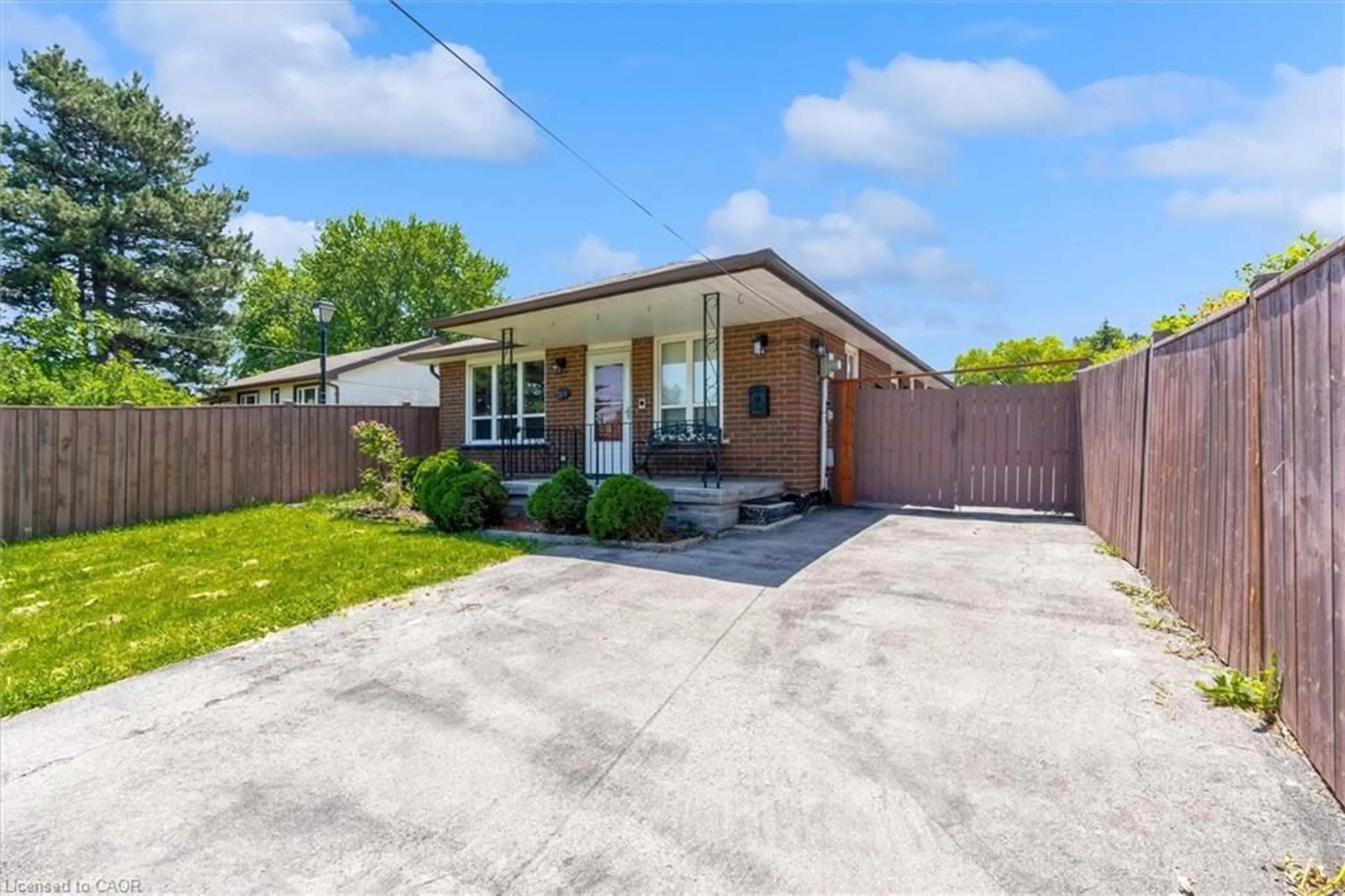 Home with brick exterior material, street for 261 Limeridge Rd, Hamilton Ontario L9C 2V4