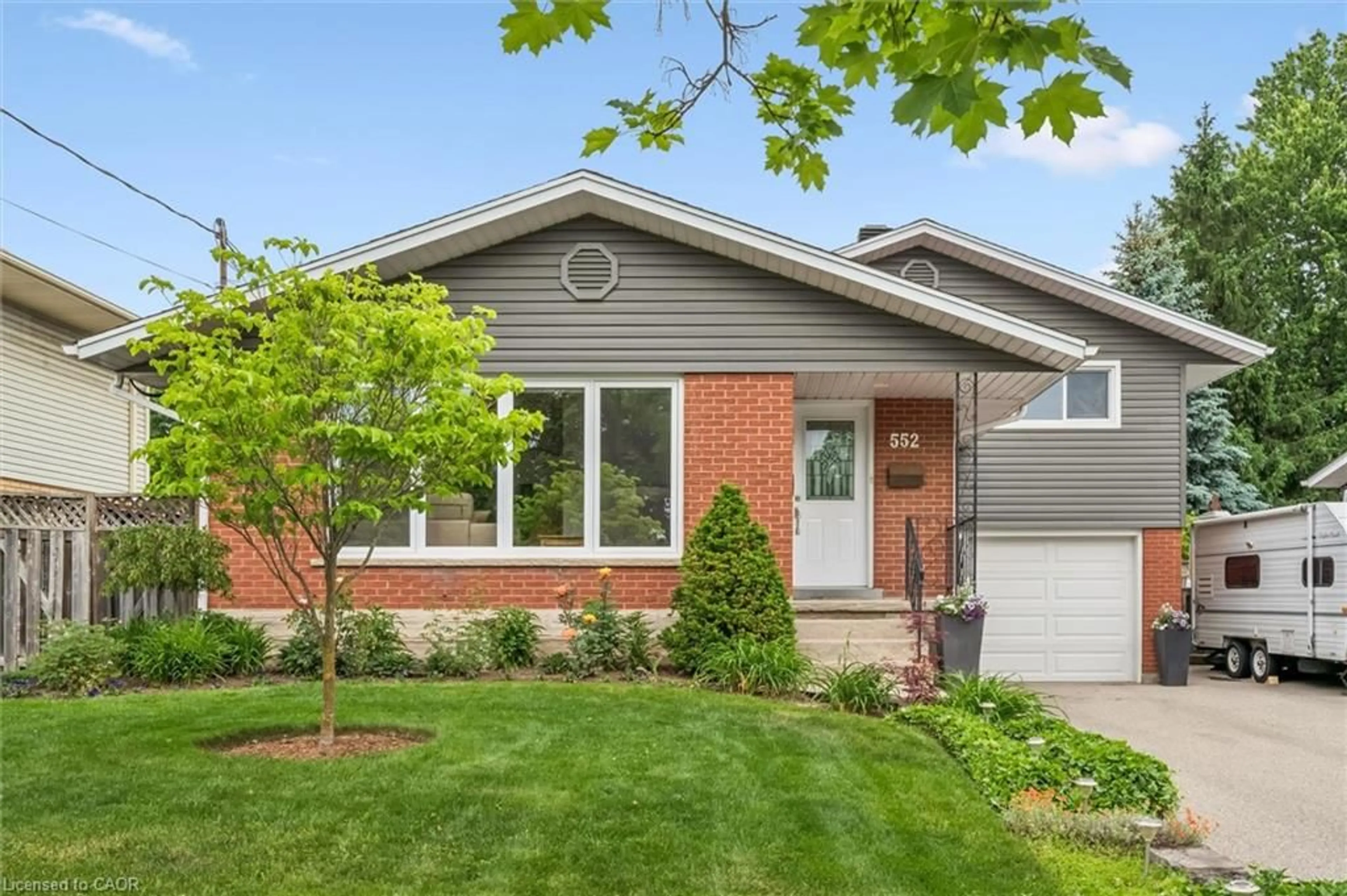 Home with brick exterior material, street for 552 Greenbrook Dr, Kitchener Ontario N2M 4K6