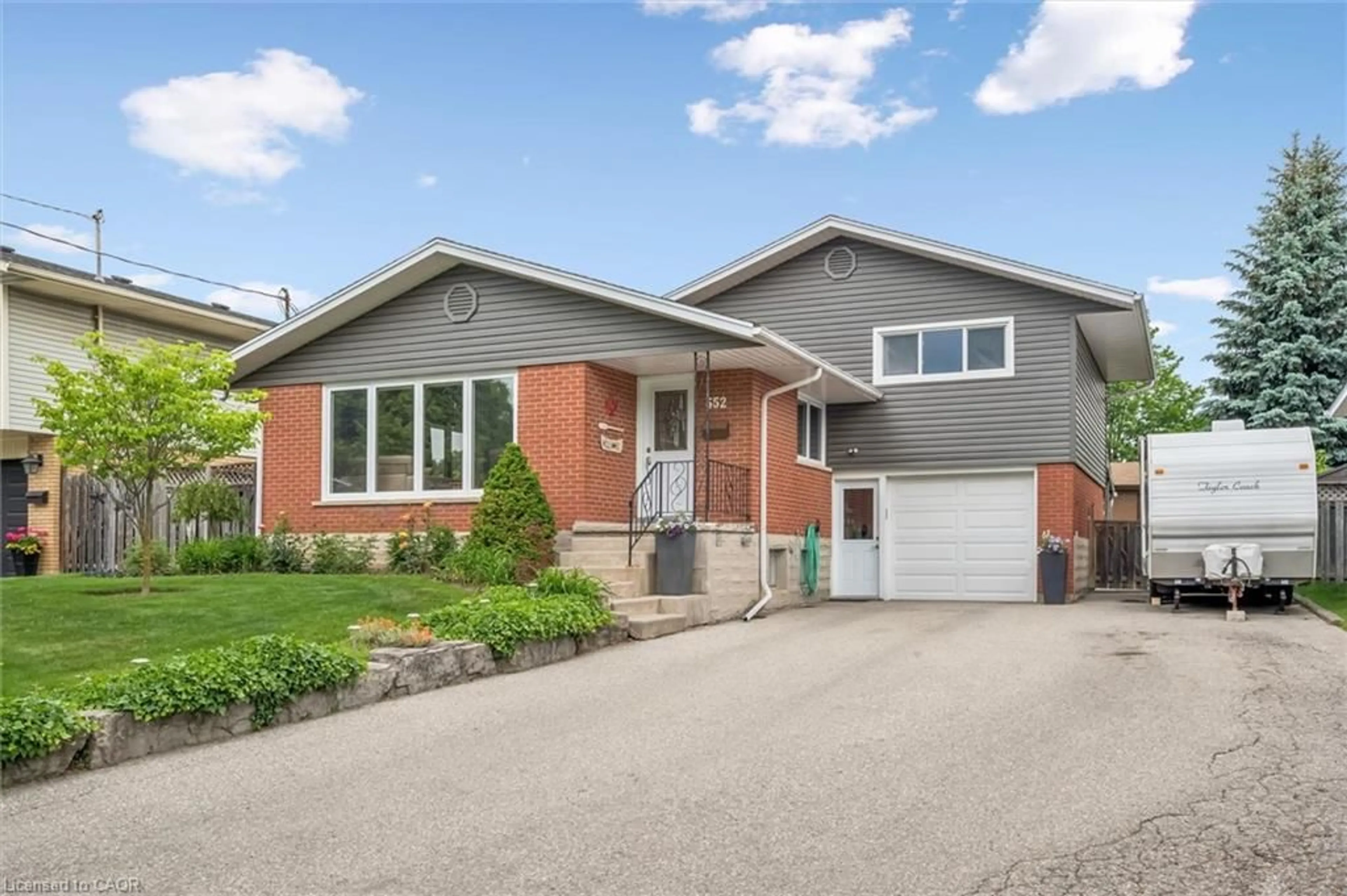 Home with brick exterior material, street for 552 Greenbrook Dr, Kitchener Ontario N2M 4K6