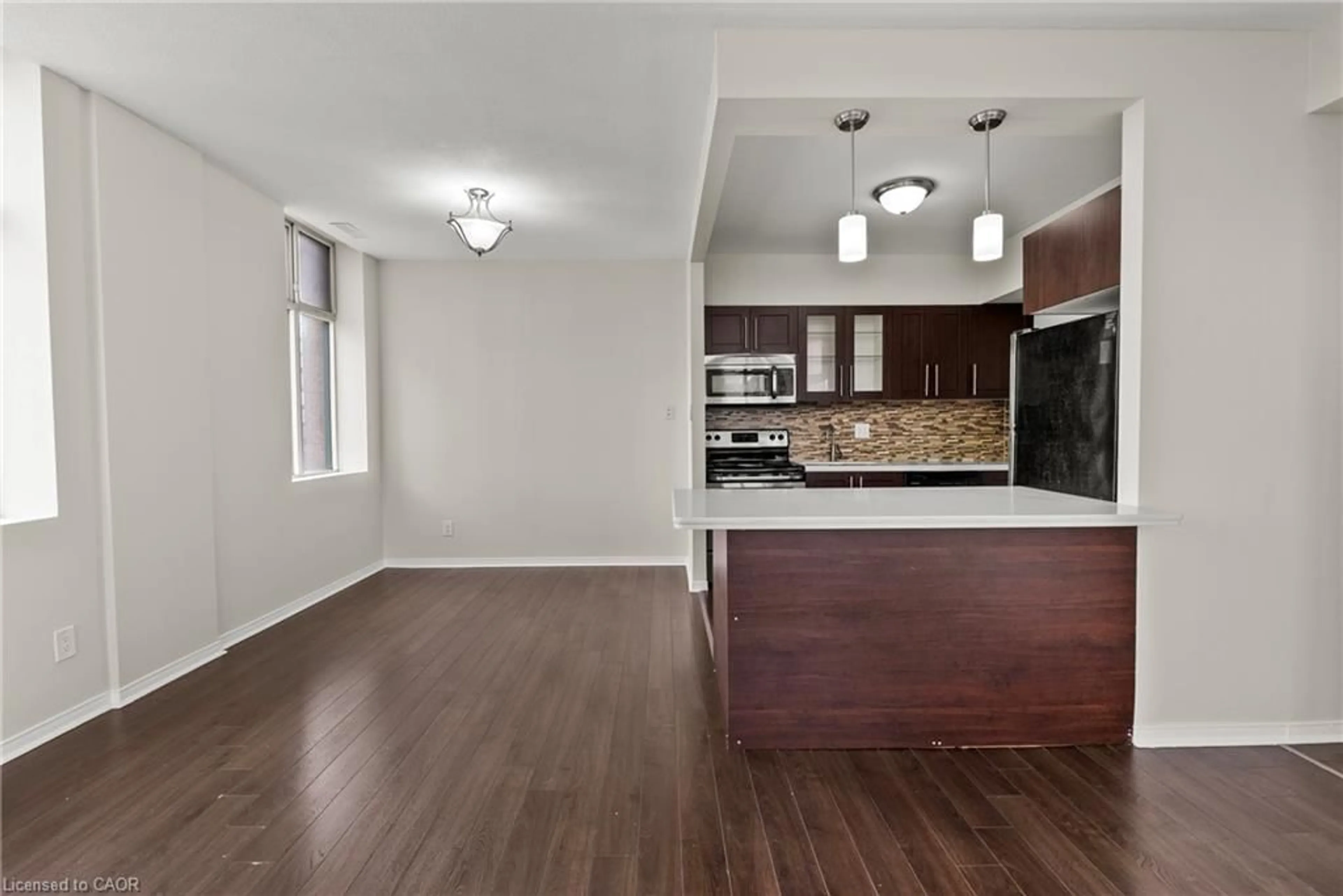Open concept kitchen, wood/laminate floor for 36 James St #1402, Hamilton Ontario L8P 4W4