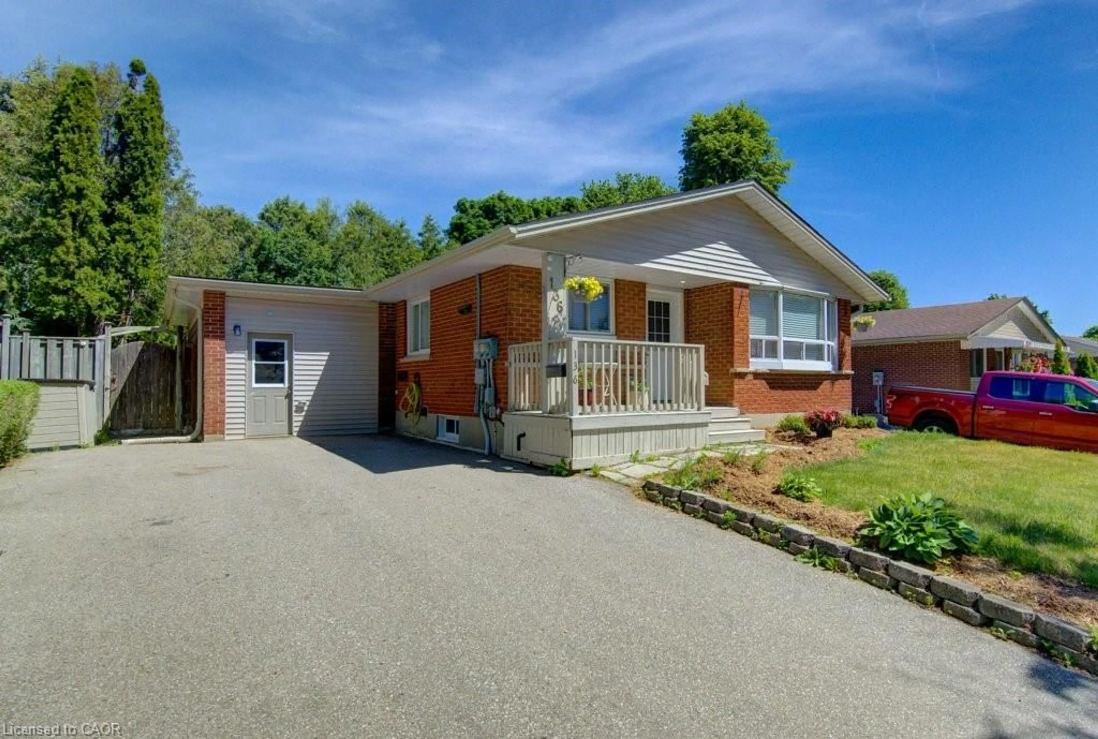 Home with brick exterior material, street for 136 Dunsmere Dr, Kitchener Ontario N2E 1V7