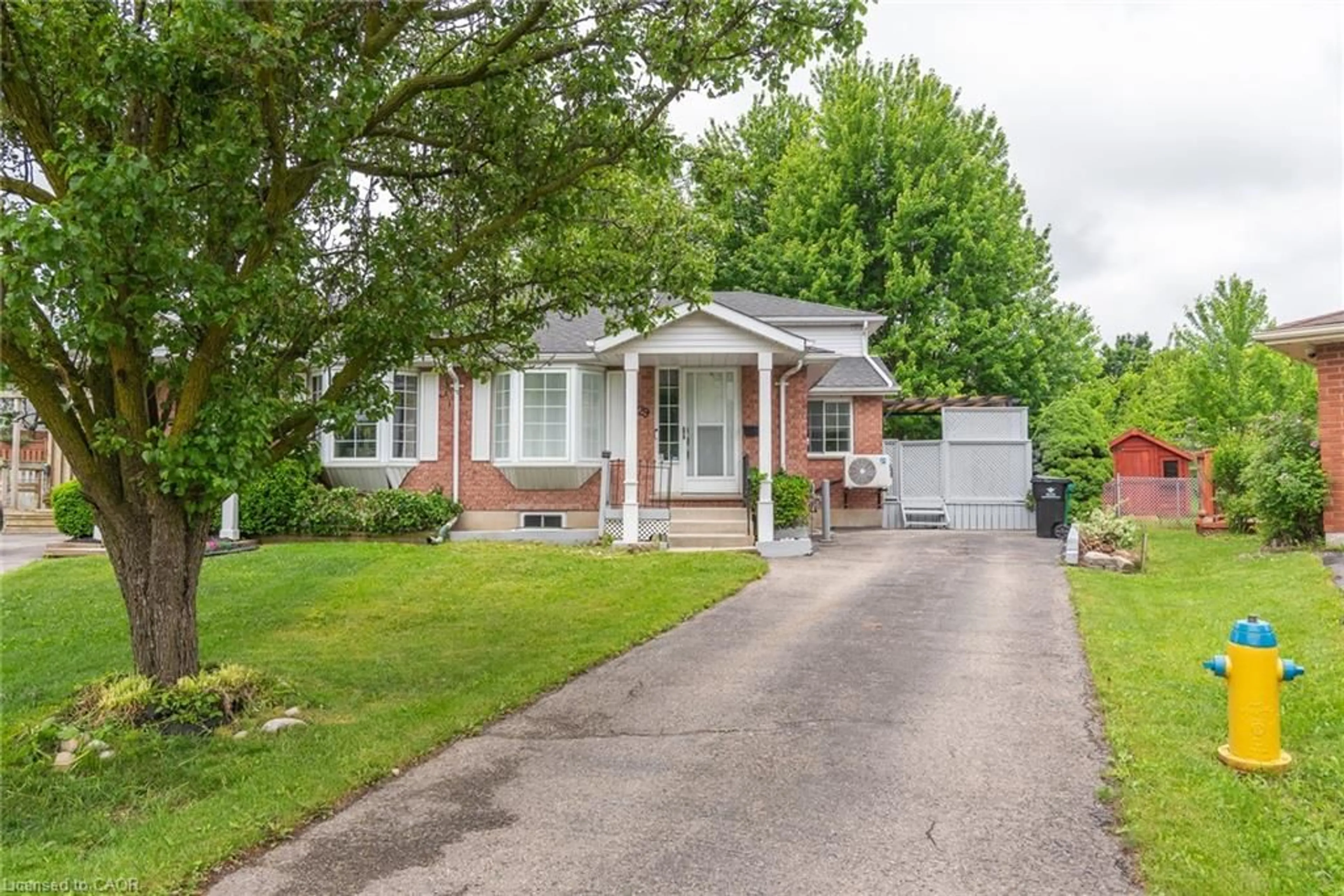 Home with brick exterior material, street for 629 Settlersfield Crt #B, Waterloo Ontario N2T 2K6