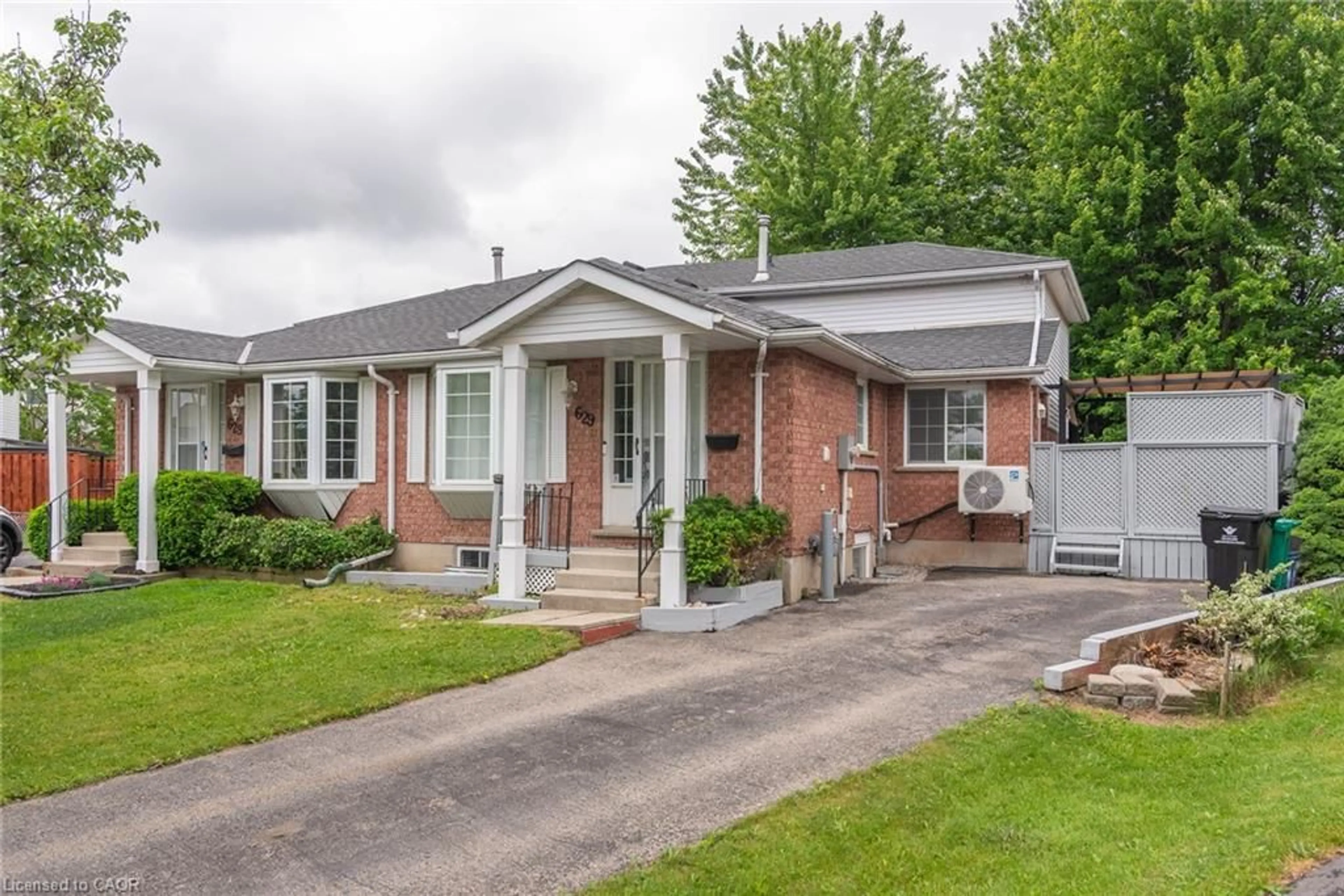 Home with brick exterior material, street for 629 Settlersfield Crt #B, Waterloo Ontario N2T 2K6