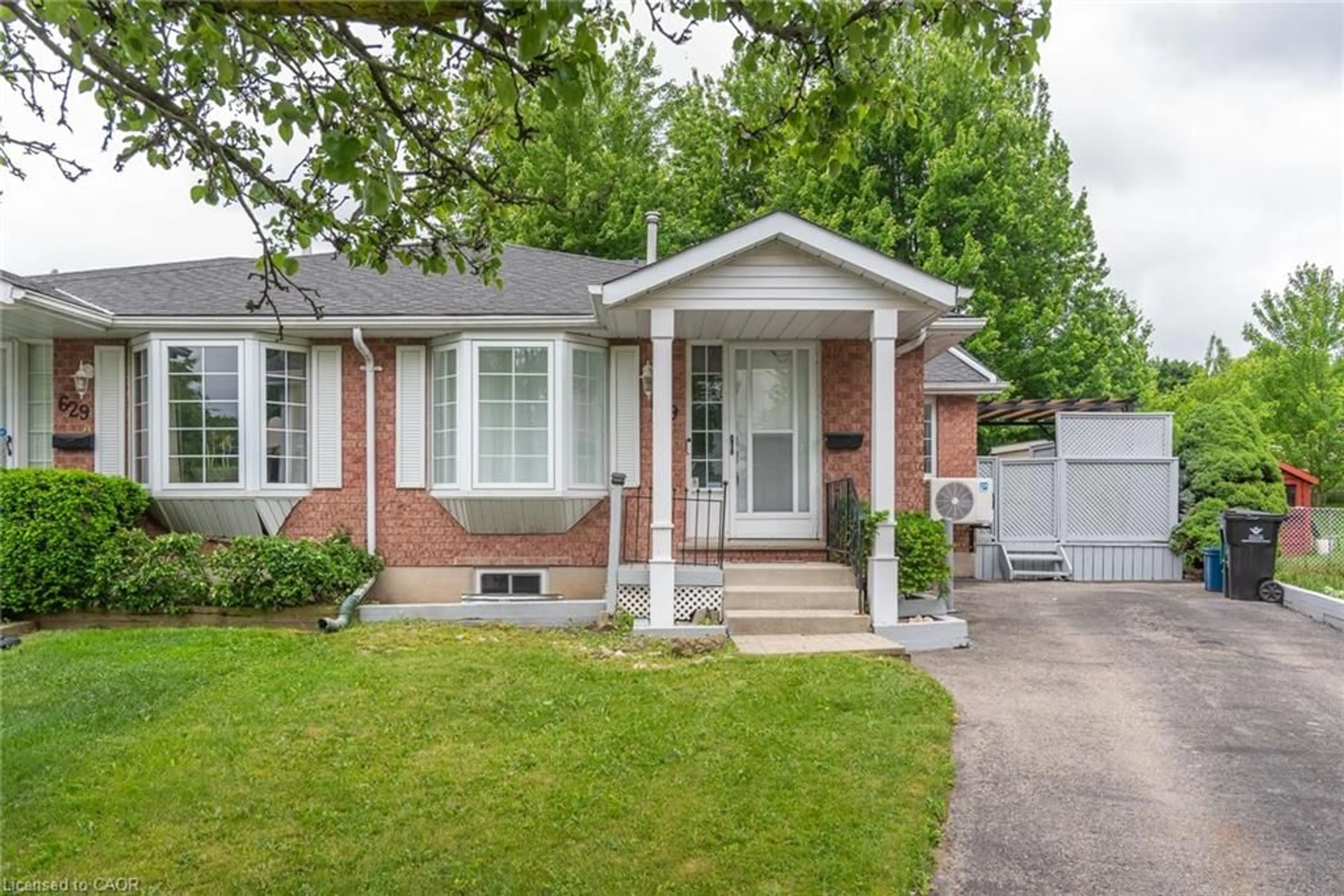 Home with brick exterior material, street for 629 Settlersfield Crt #B, Waterloo Ontario N2T 2K6