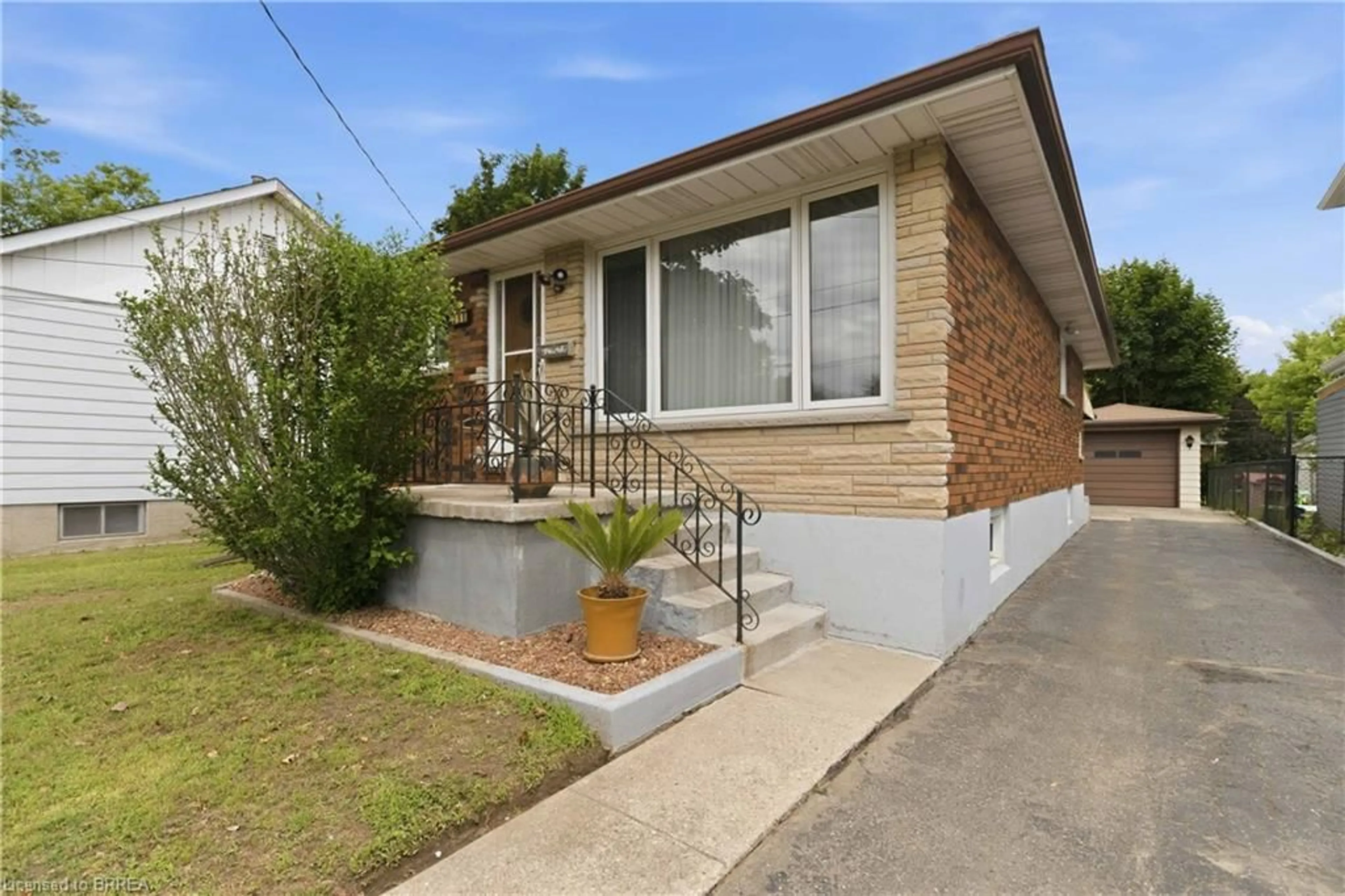 Home with brick exterior material, street for 398 Sheridan St, Brantford Ontario N3S 4S4