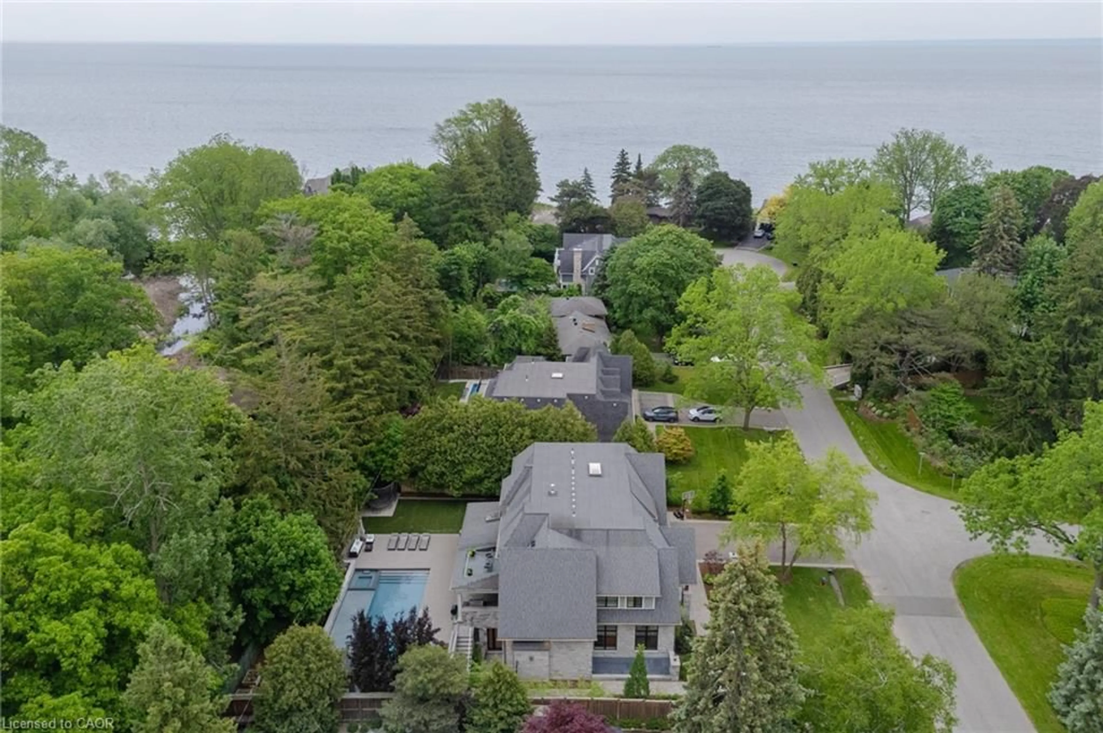 A pic from outside/outdoor area/front of a property/back of a property/a pic from drone, water/lake/river/ocean view for 129 Wolfdale Ave, Oakville Ontario L6L 4R9