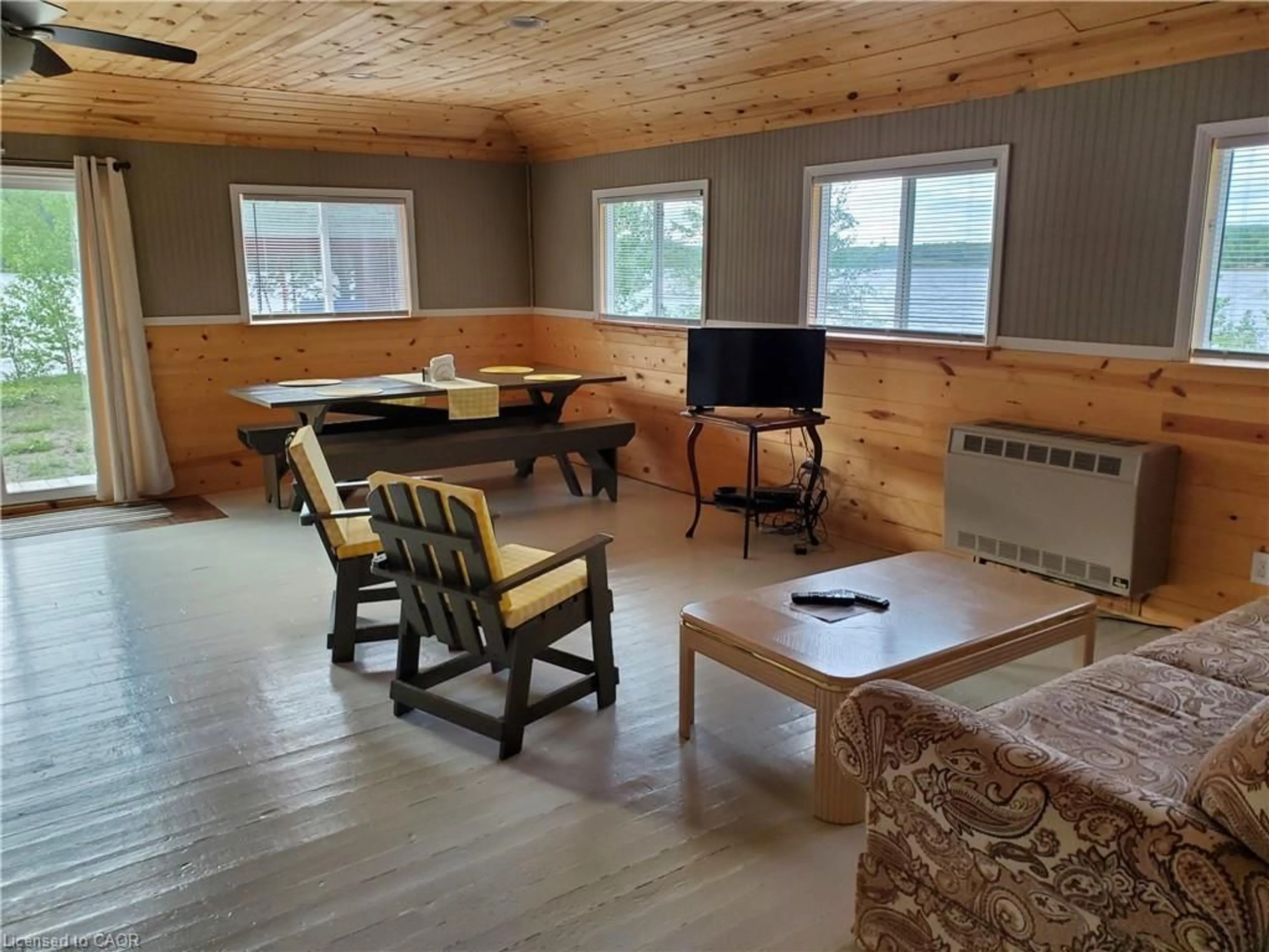 Living room with furniture, wood/laminate floor for 464 Highway 11, Greenstone Ontario P0T 2J0