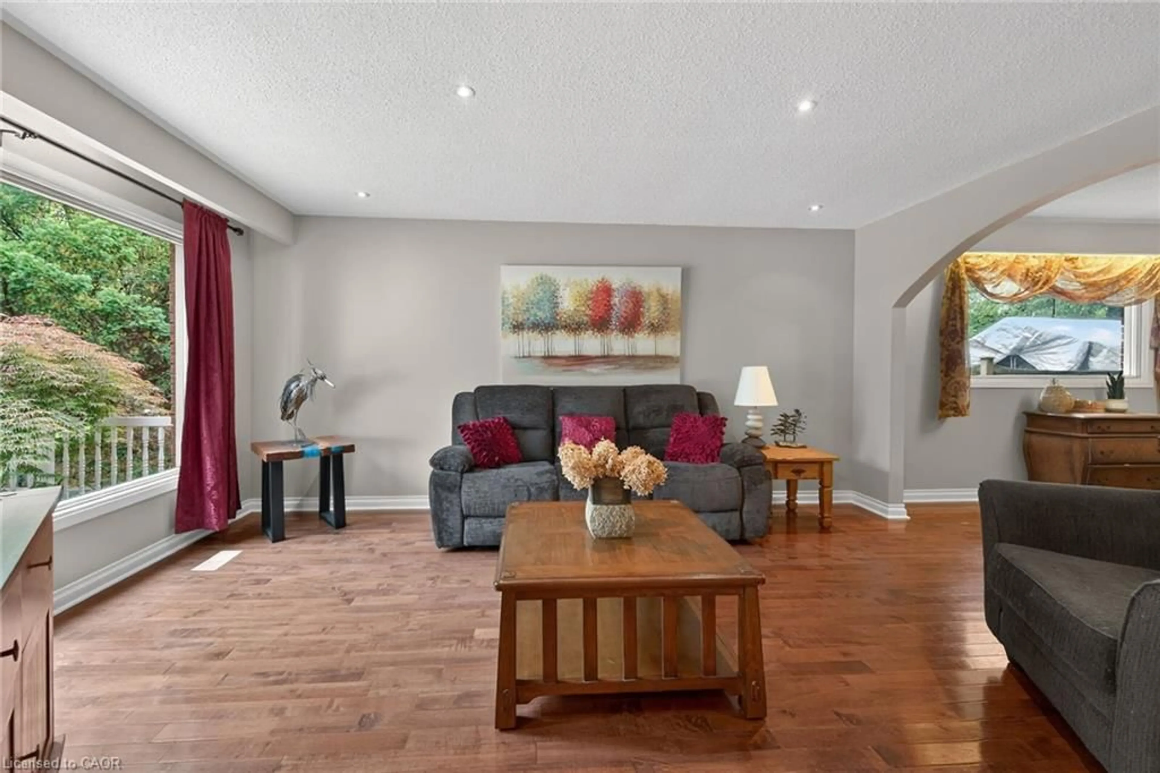 Living room with furniture, wood/laminate floor for 25 Inverness Ave, Hamilton Ontario L9C 1A1