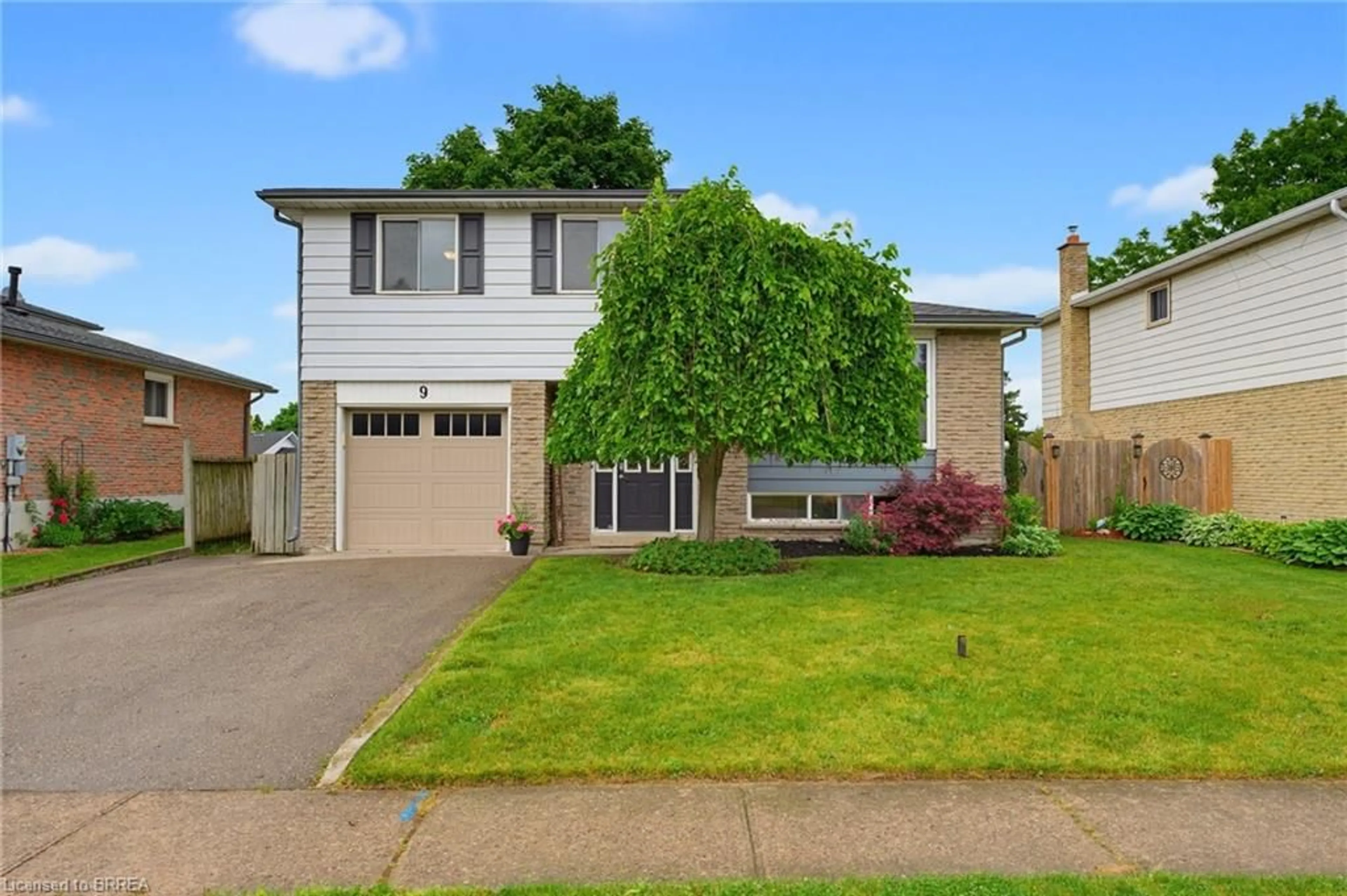 Home with vinyl exterior material, street for 9 Larkspur Lane, Paris Ontario N3L 3P2
