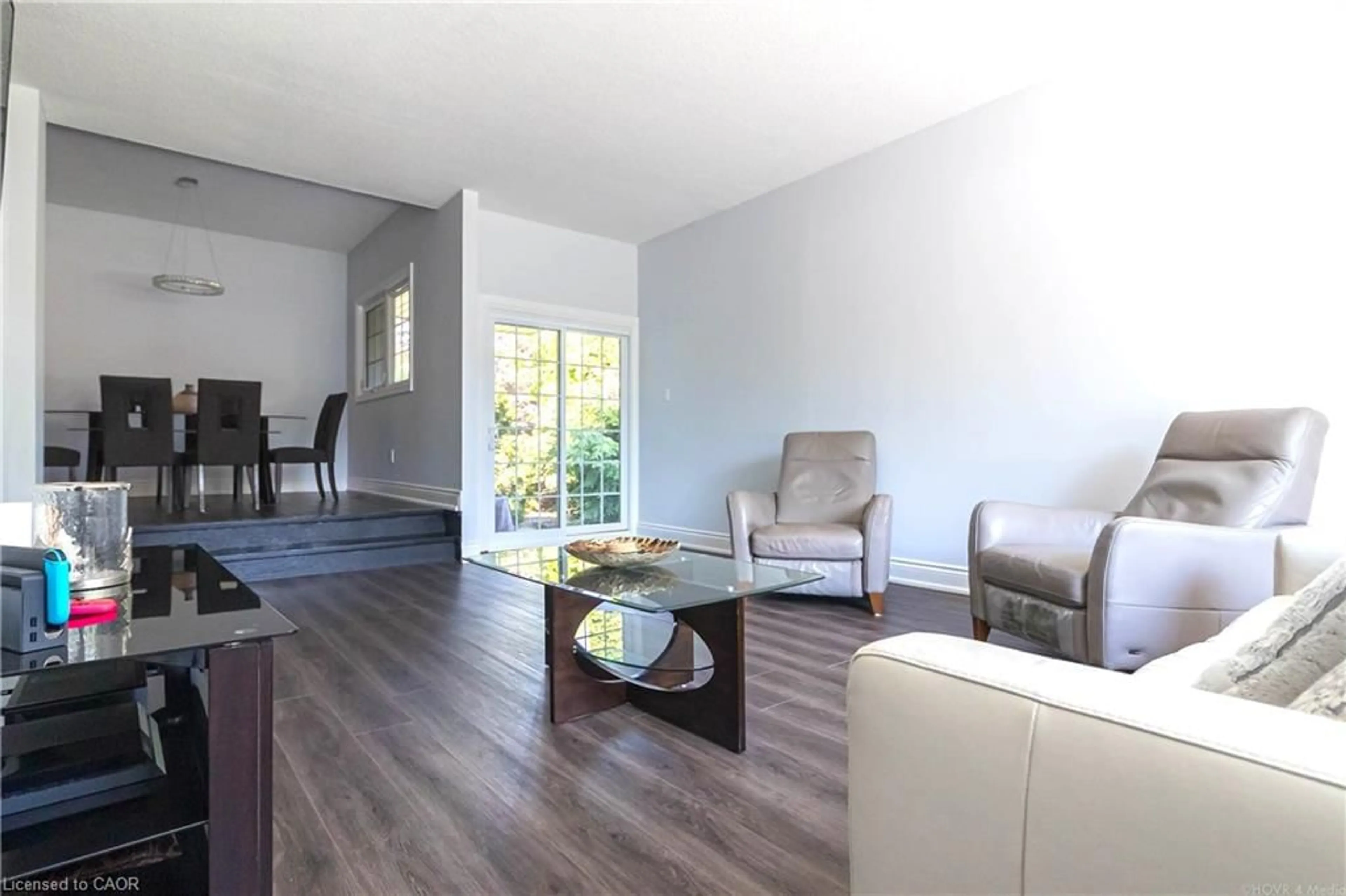 Living room with furniture, wood/laminate floor for 2390 Sinclair Cir, Burlington Ontario L7P 3C3