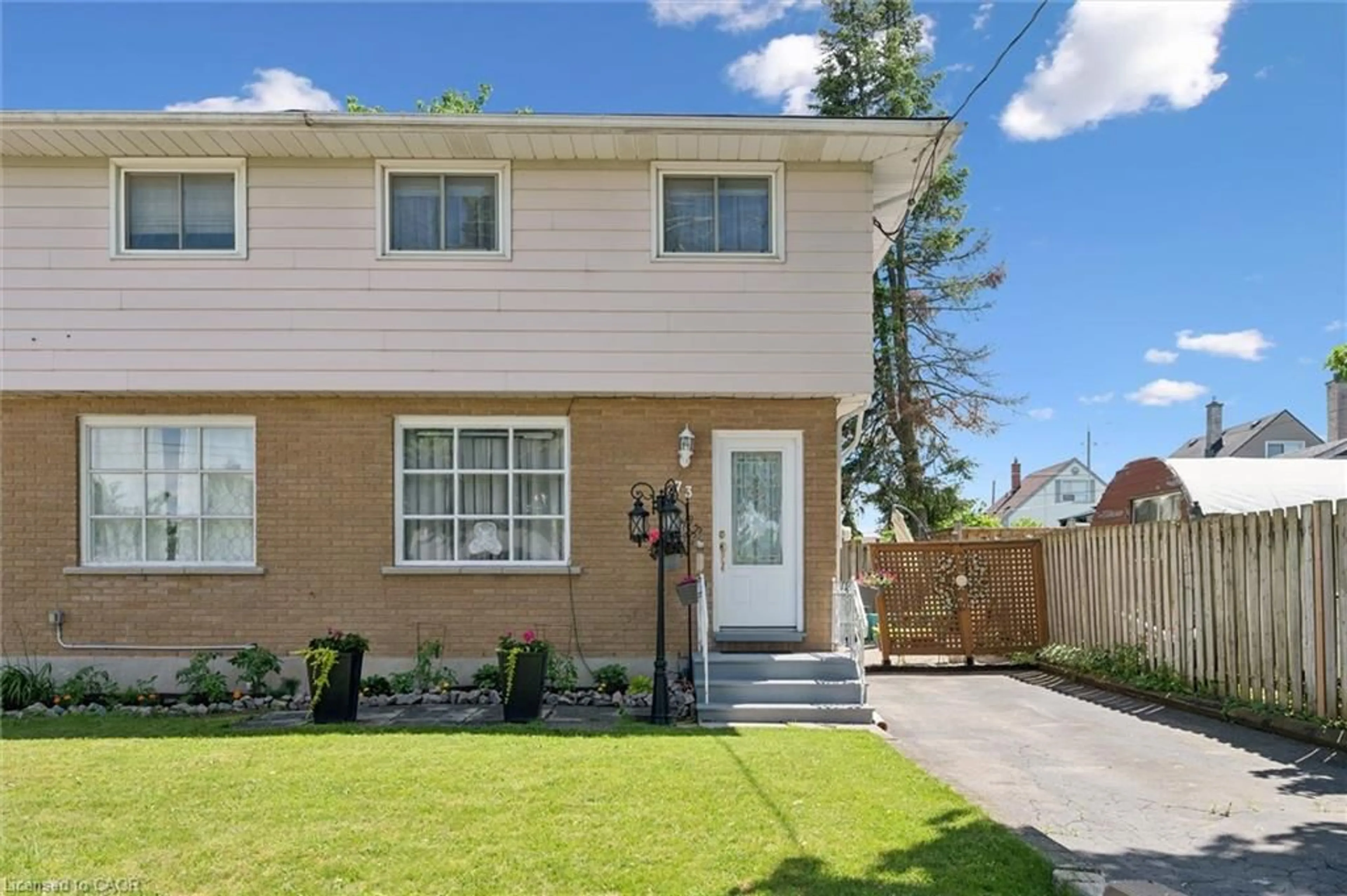 Home with vinyl exterior material, street for 73 Henry St, Cambridge Ontario N1R 3W5