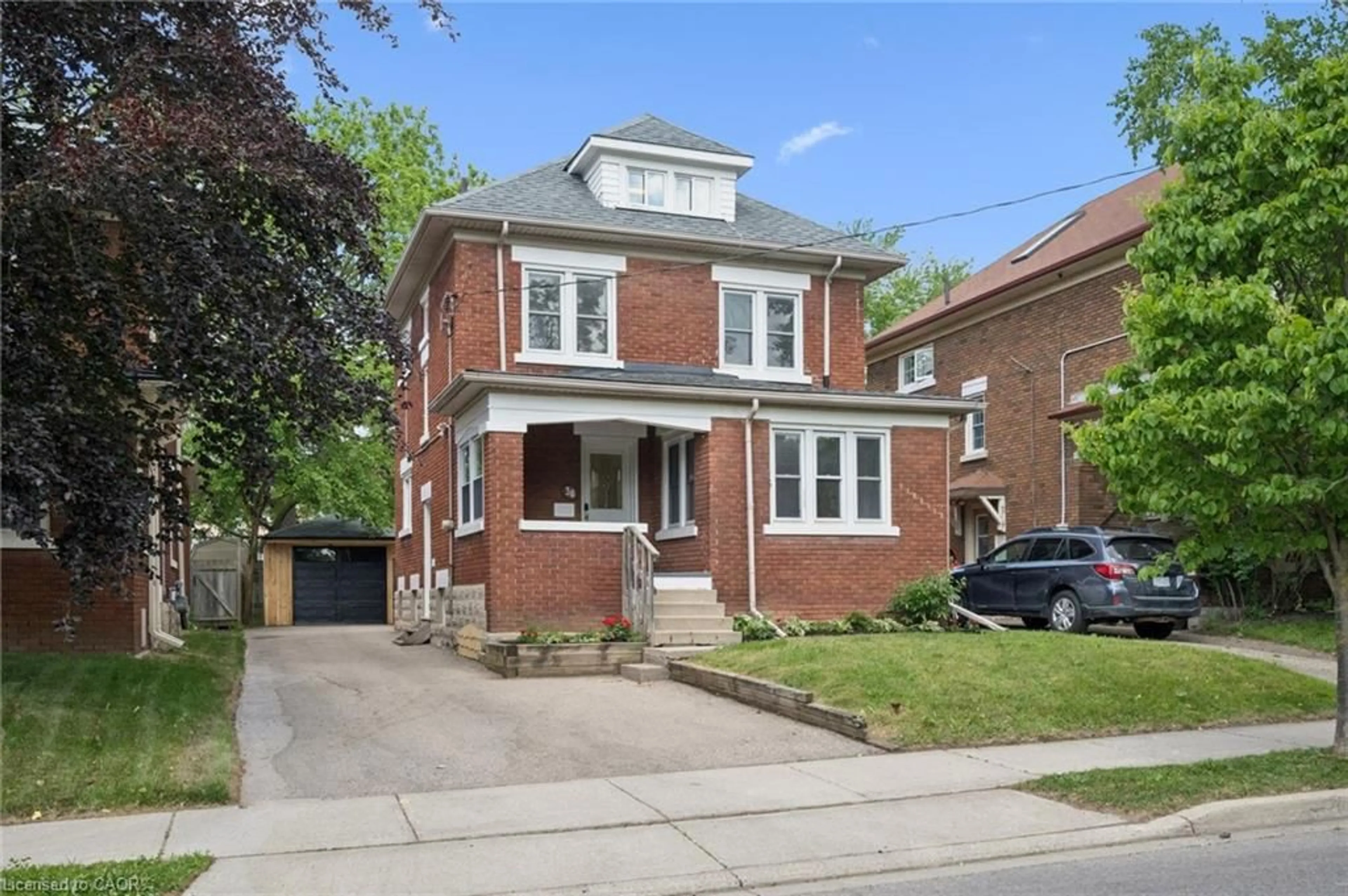 Home with brick exterior material, street for 38 Stirling Ave, Kitchener Ontario N2H 3G5
