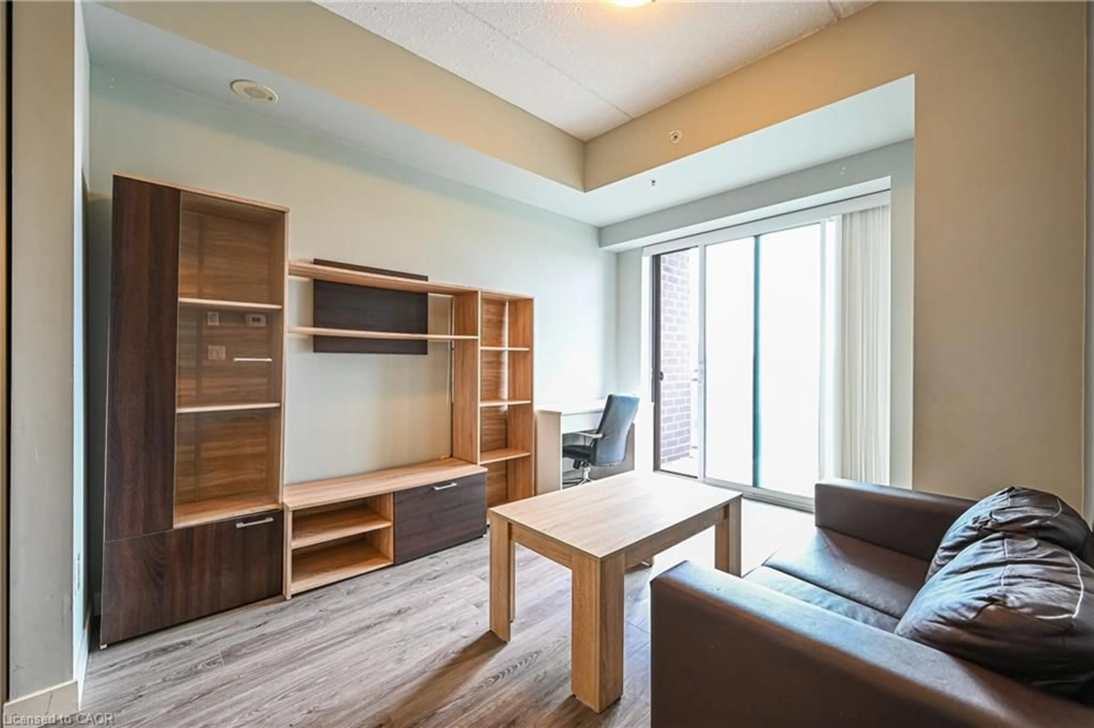 Living room with furniture, wood/laminate floor for 318 Spruce St #1009, Waterloo Ontario N2L 3M7