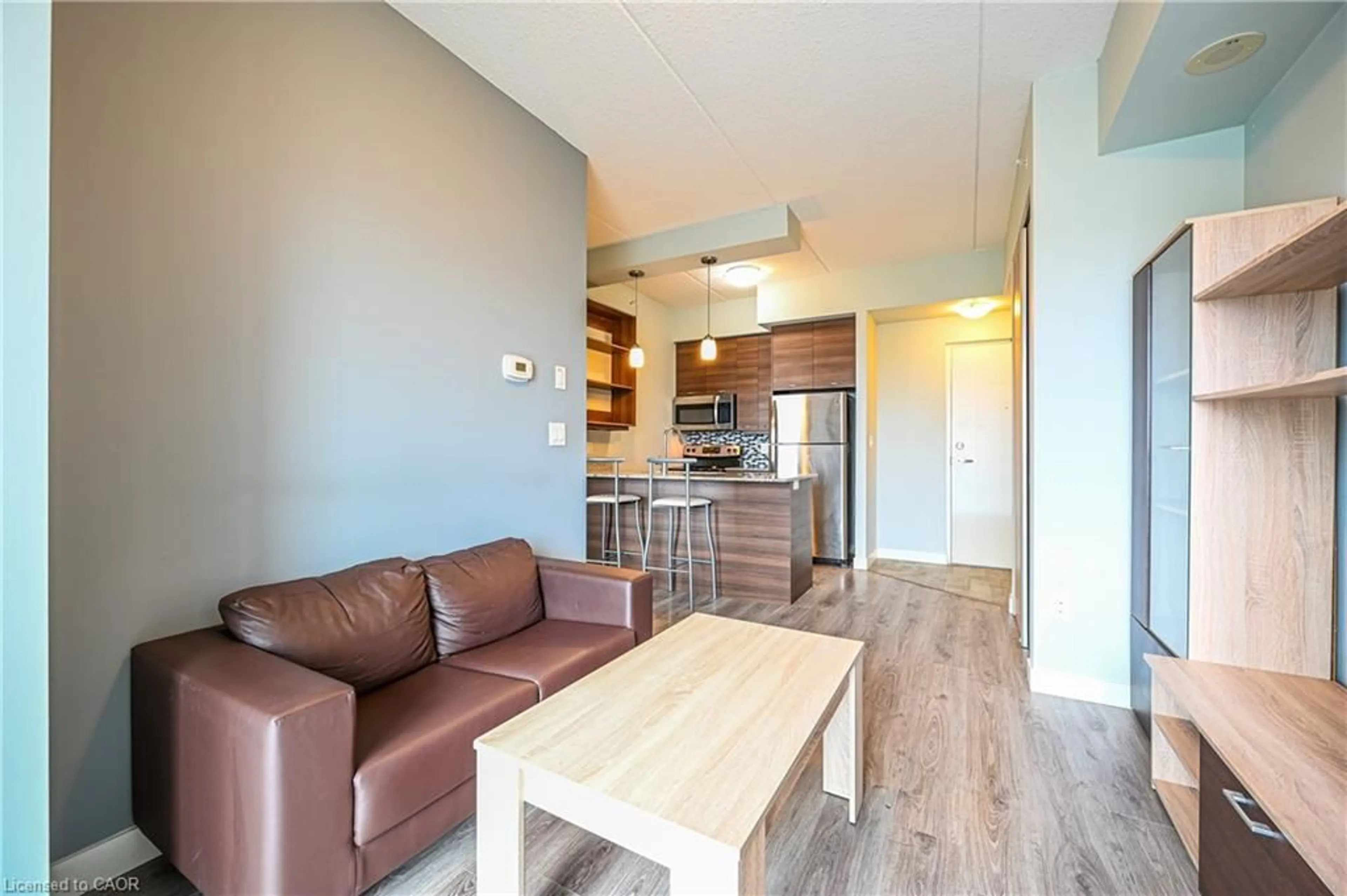 Living room with furniture, wood/laminate floor for 318 Spruce St #1009, Waterloo Ontario N2L 3M7