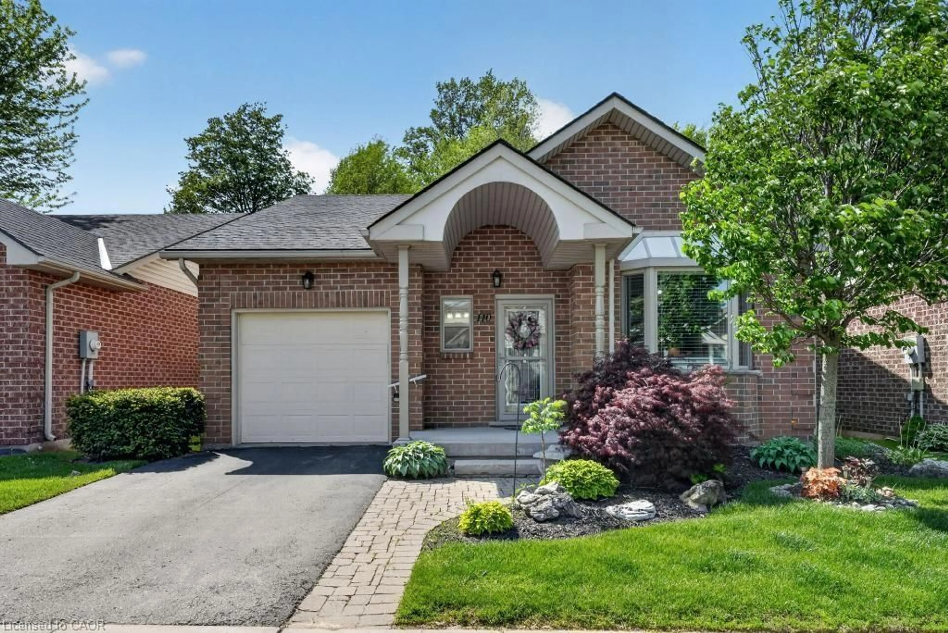 Home with brick exterior material, street for 110 Greentrail Dr, Mount Hope Ontario L0R 1W0