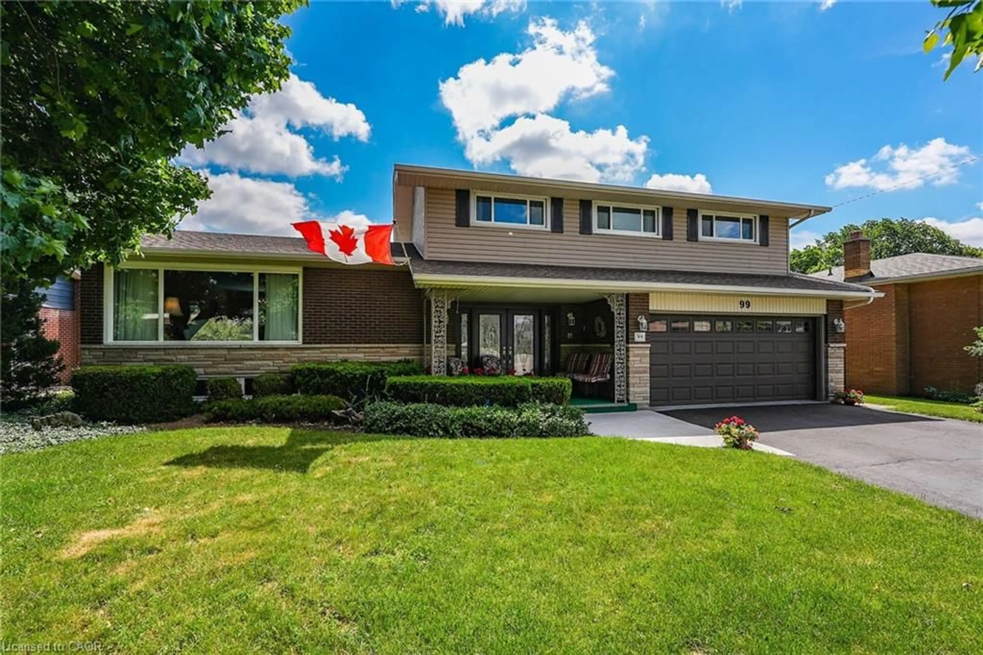 Home with brick exterior material, street for 99 Elmhurst Dr, Hamilton Ontario L8T 1C5
