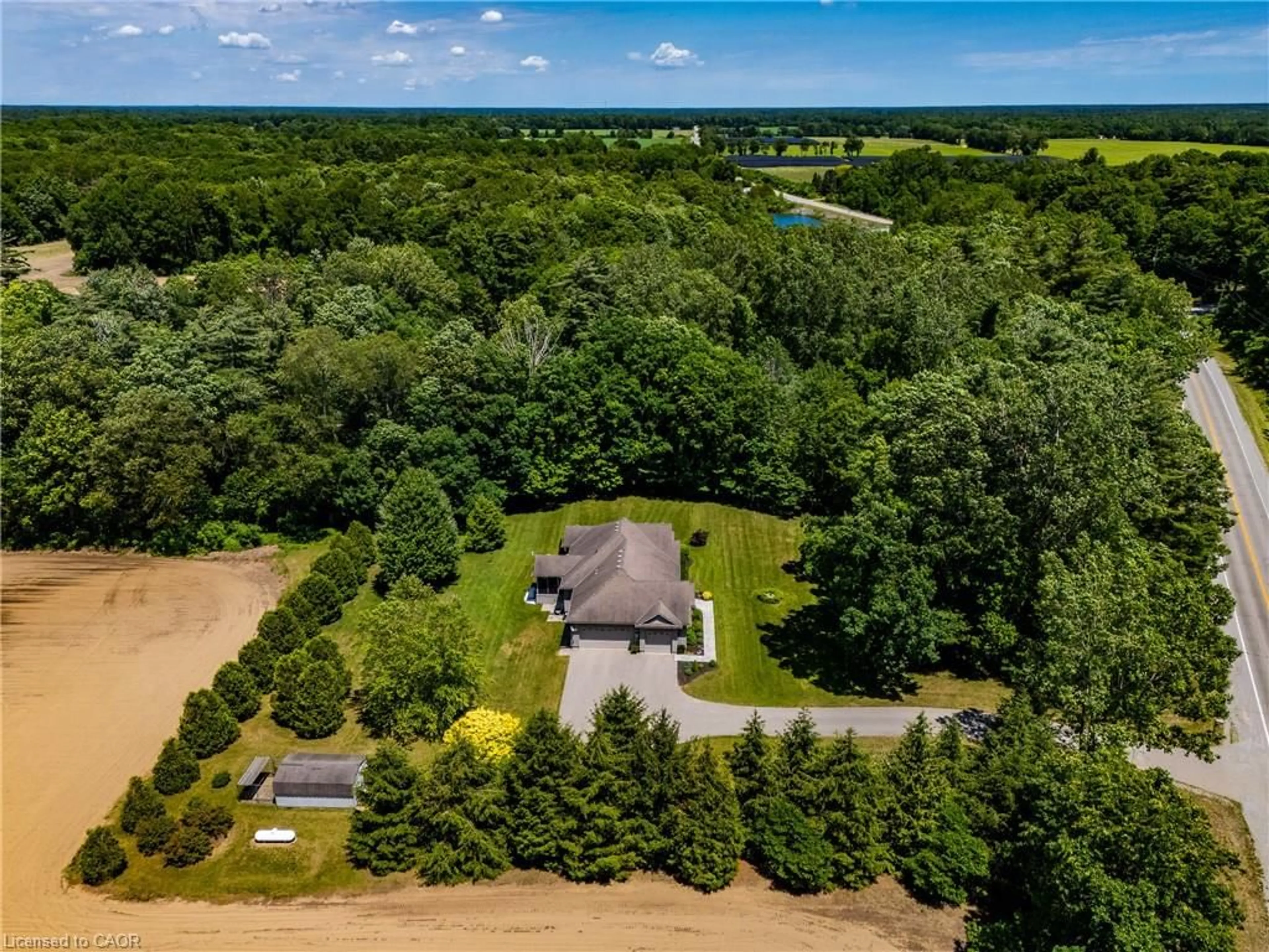 A pic from outside/outdoor area/front of a property/back of a property/a pic from drone, water/lake/river/ocean view for 1821 Norfolk County Road 45, Langton Ontario N0E 1G0