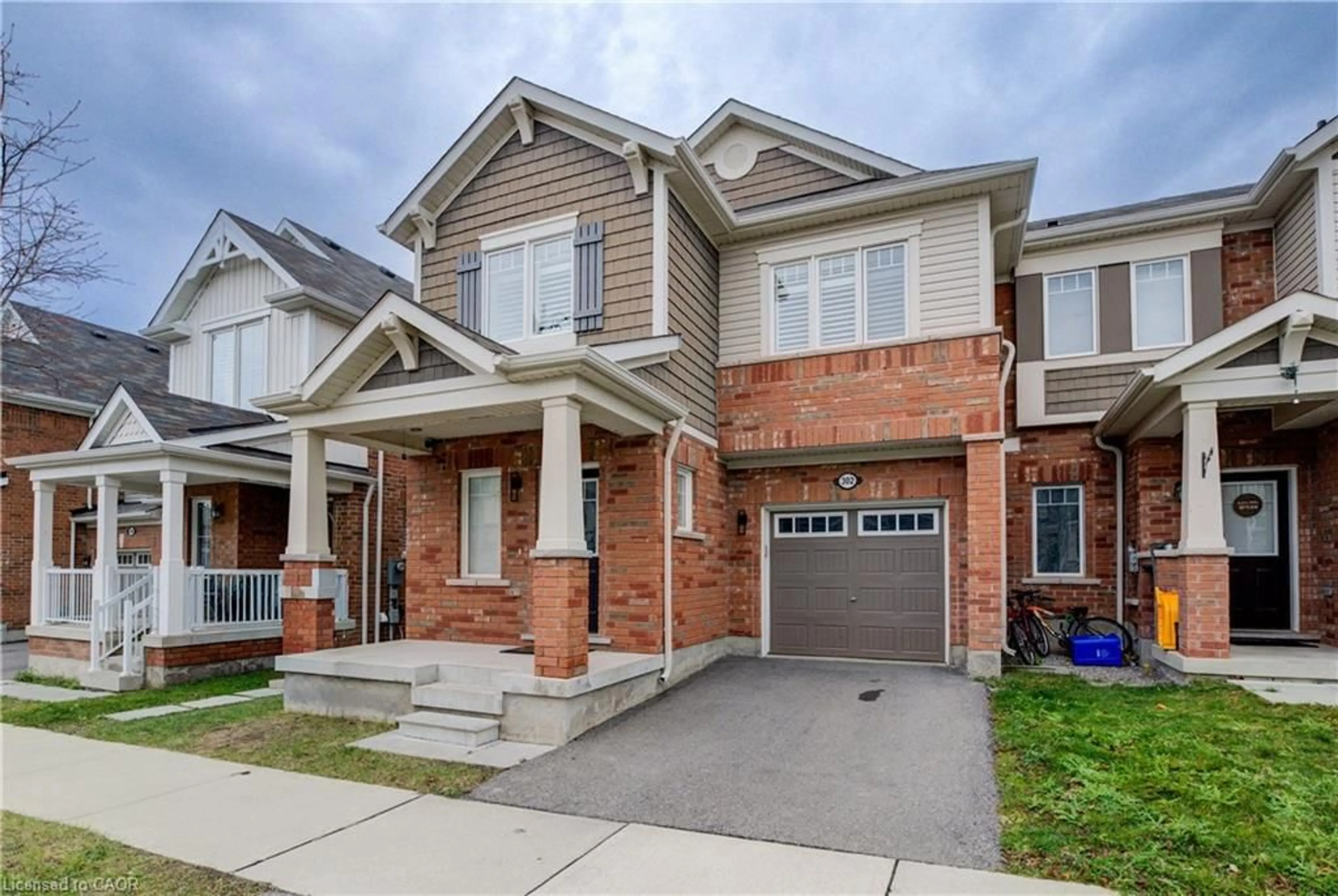 Home with brick exterior material, street for 302 Jean Landng, Milton Ontario L9E 1C6