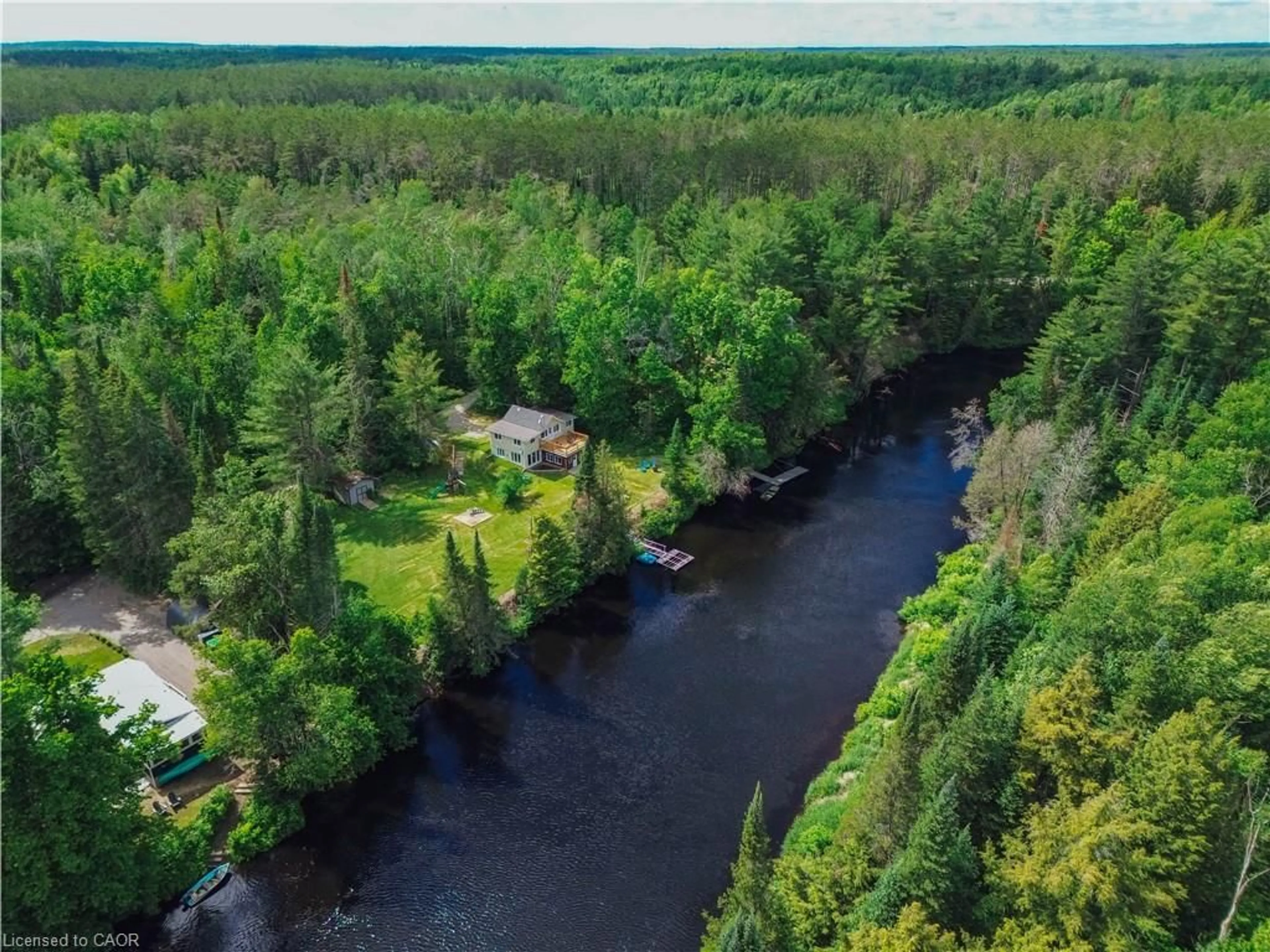 A pic from outside/outdoor area/front of a property/back of a property/a pic from drone, water/lake/river/ocean view for 11 Side Rd, Kinmount Ontario K0M 1C0