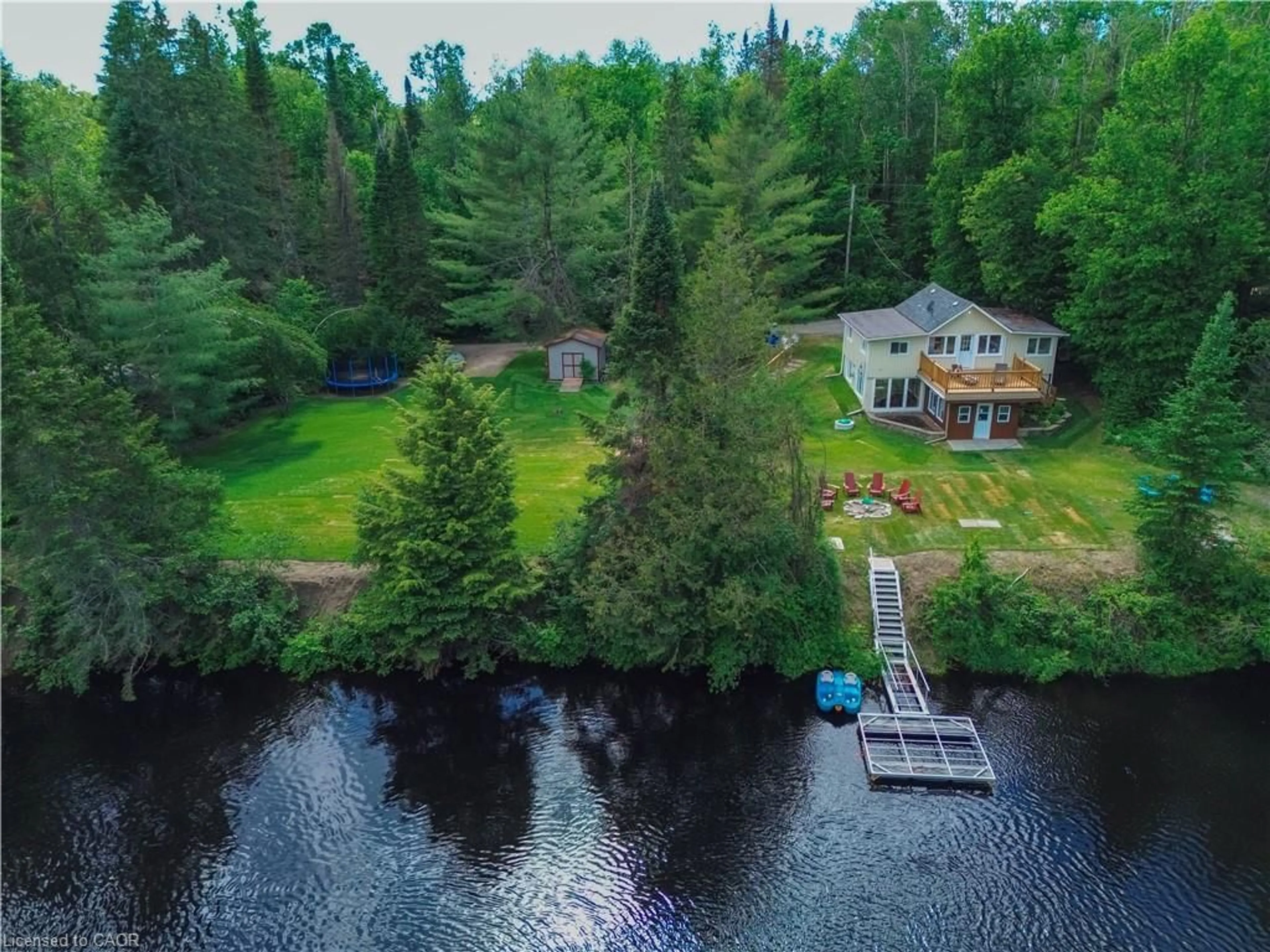 A pic from outside/outdoor area/front of a property/back of a property/a pic from drone, water/lake/river/ocean view for 11 Side Rd, Kinmount Ontario K0M 1C0