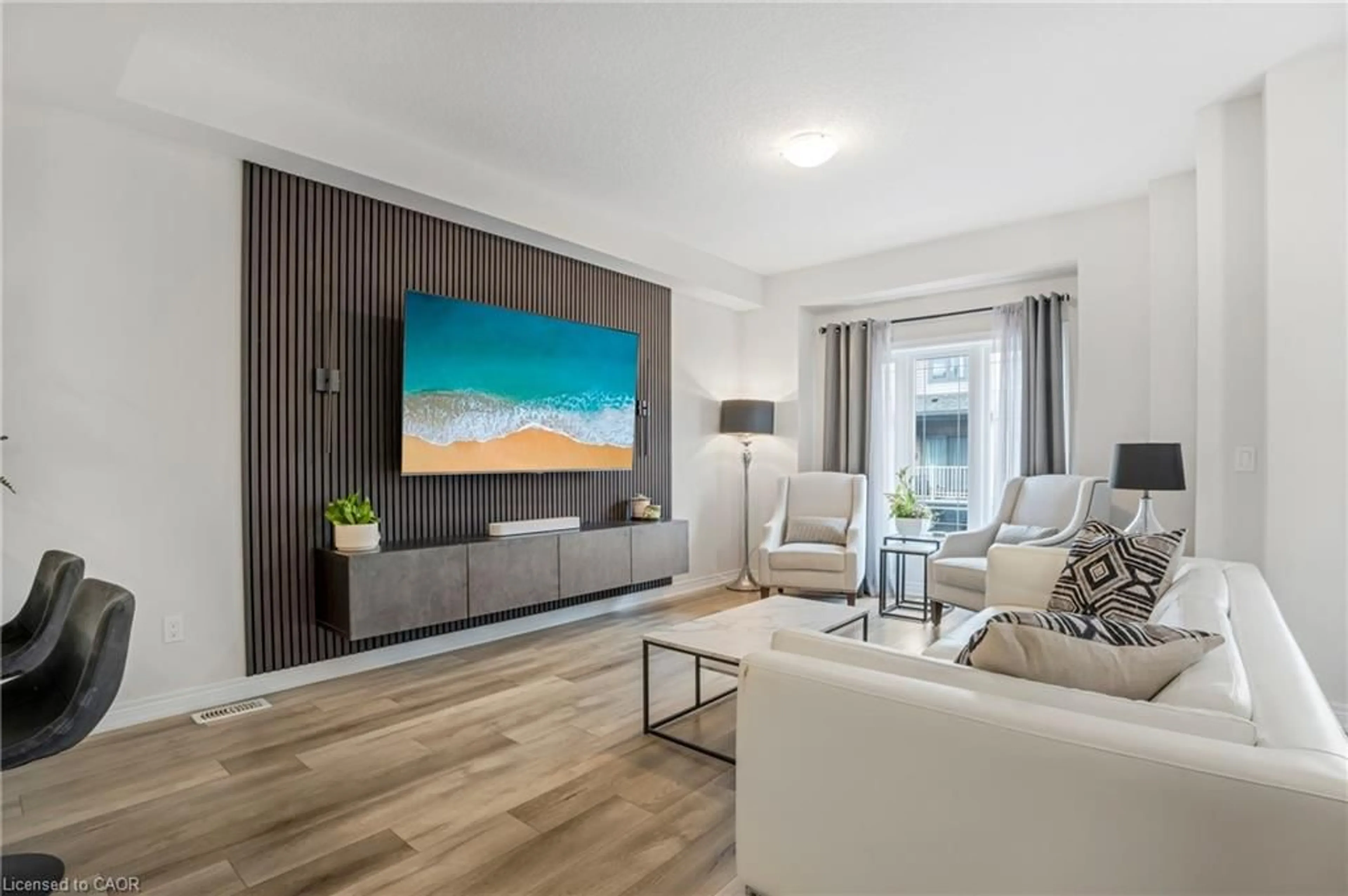 Living room with furniture, wood/laminate floor for 27 Rachel Dr #41, Hamilton Ontario L8E 0K6