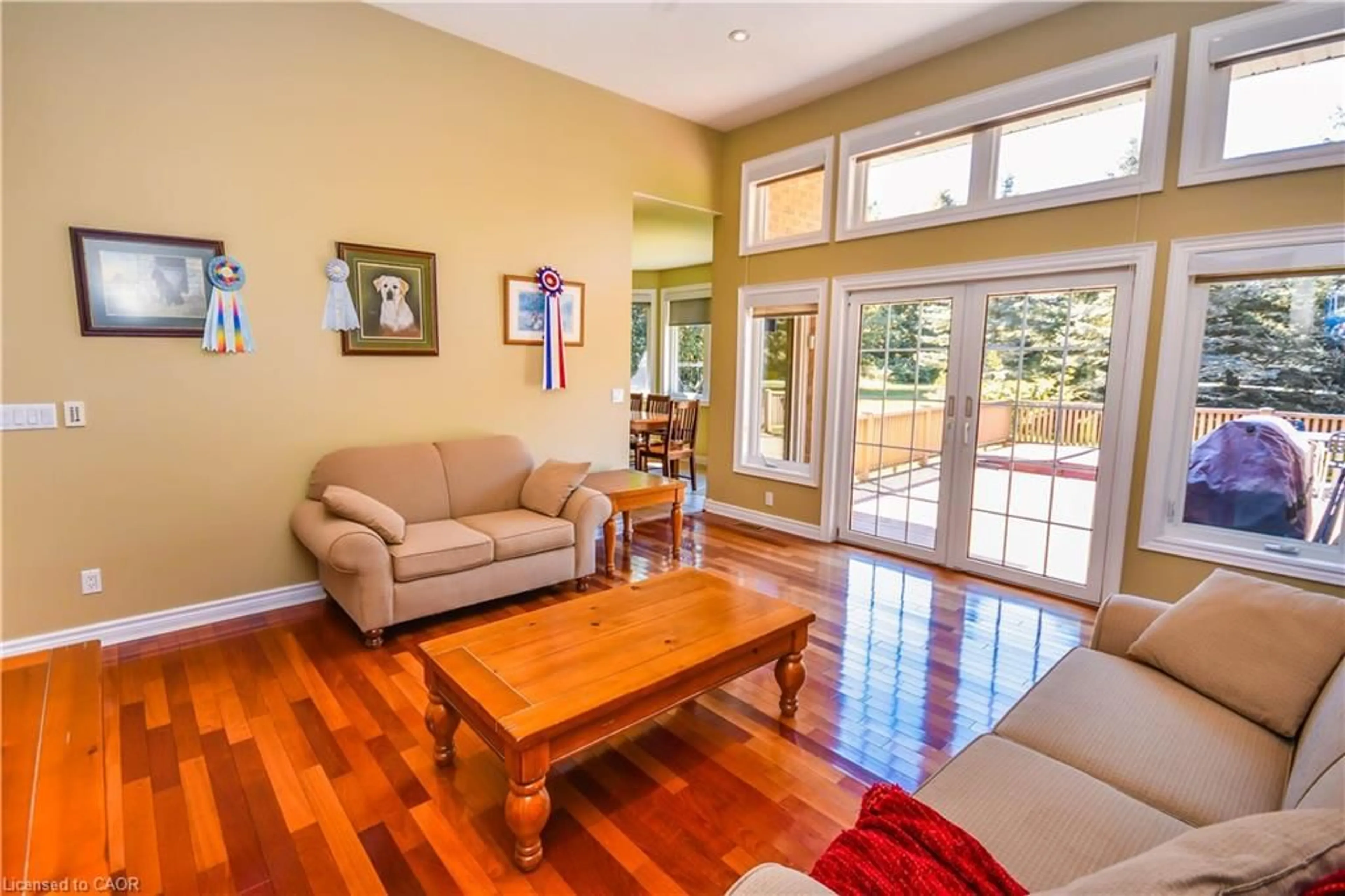 Living room with furniture, wood/laminate floor for 3040 Townline Rd, Coldwater Ontario L0K 1E0