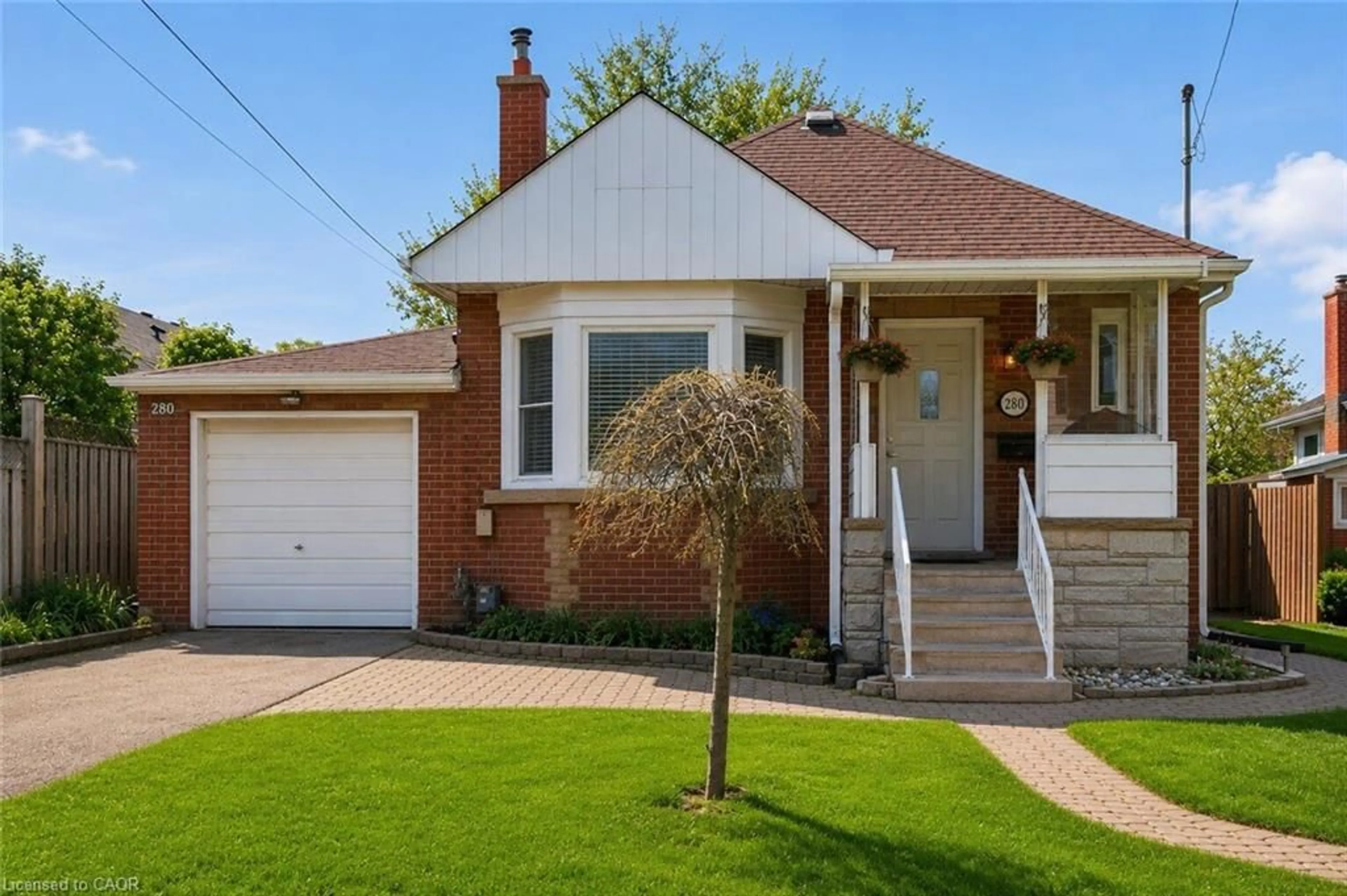 Home with brick exterior material, street for 280 East 11th St, Hamilton Ontario L9A 3T7