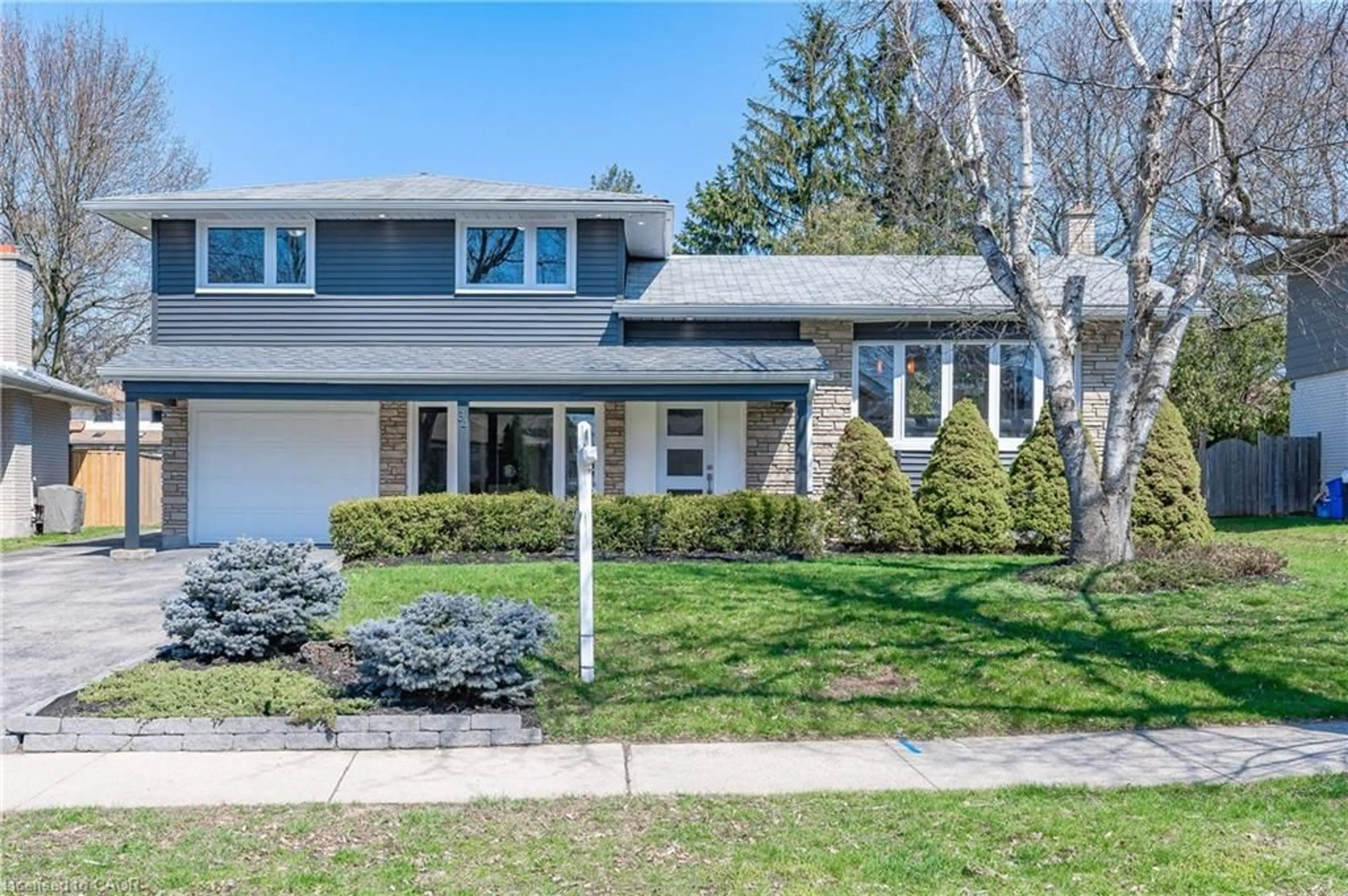 Home with vinyl exterior material, street for 34 Bradley Dr, Kitchener Ontario N2A 1K4