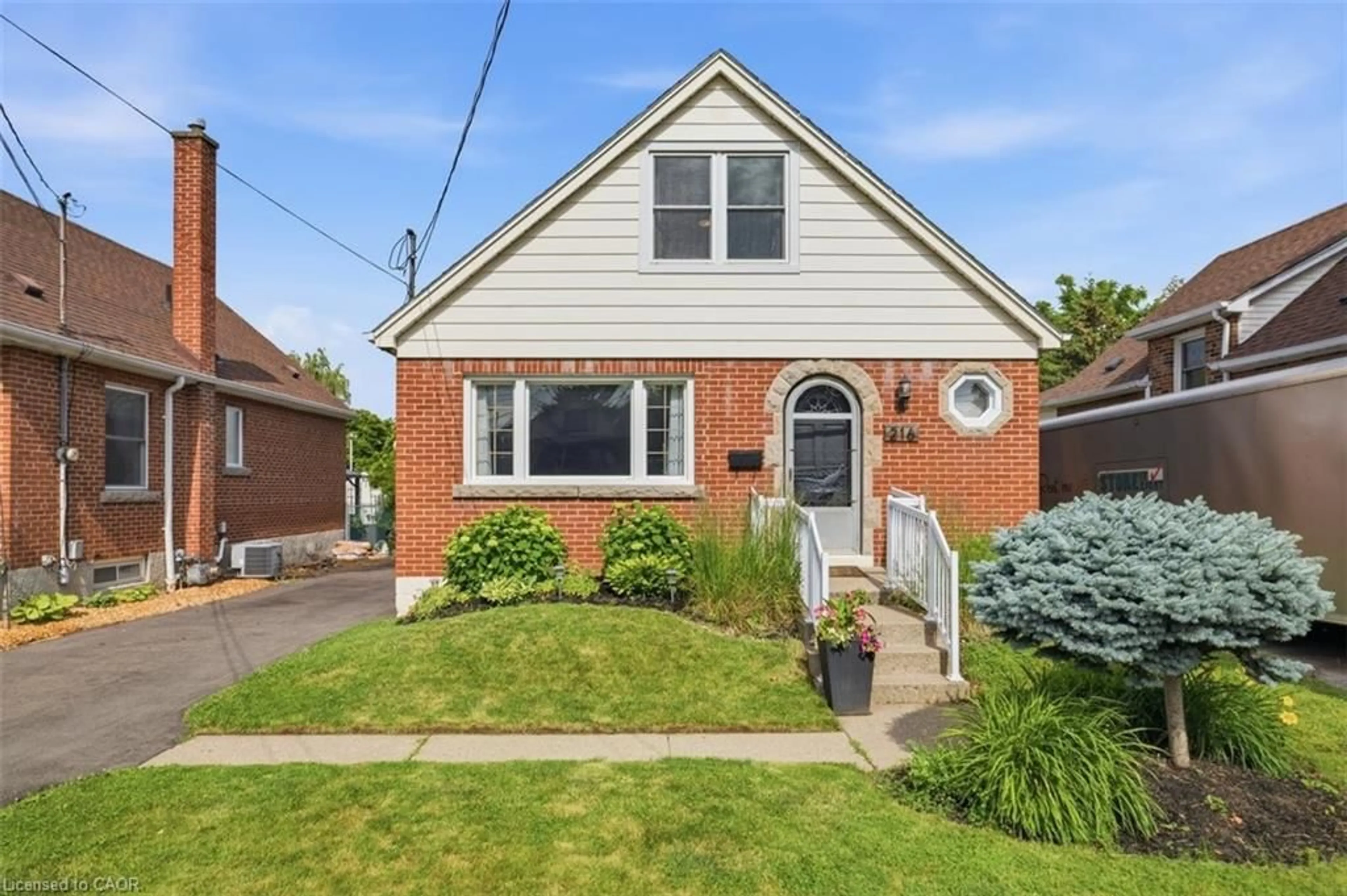 Home with brick exterior material, street for 216 Summerhill Ave, Hamilton Ontario L8K 3N7