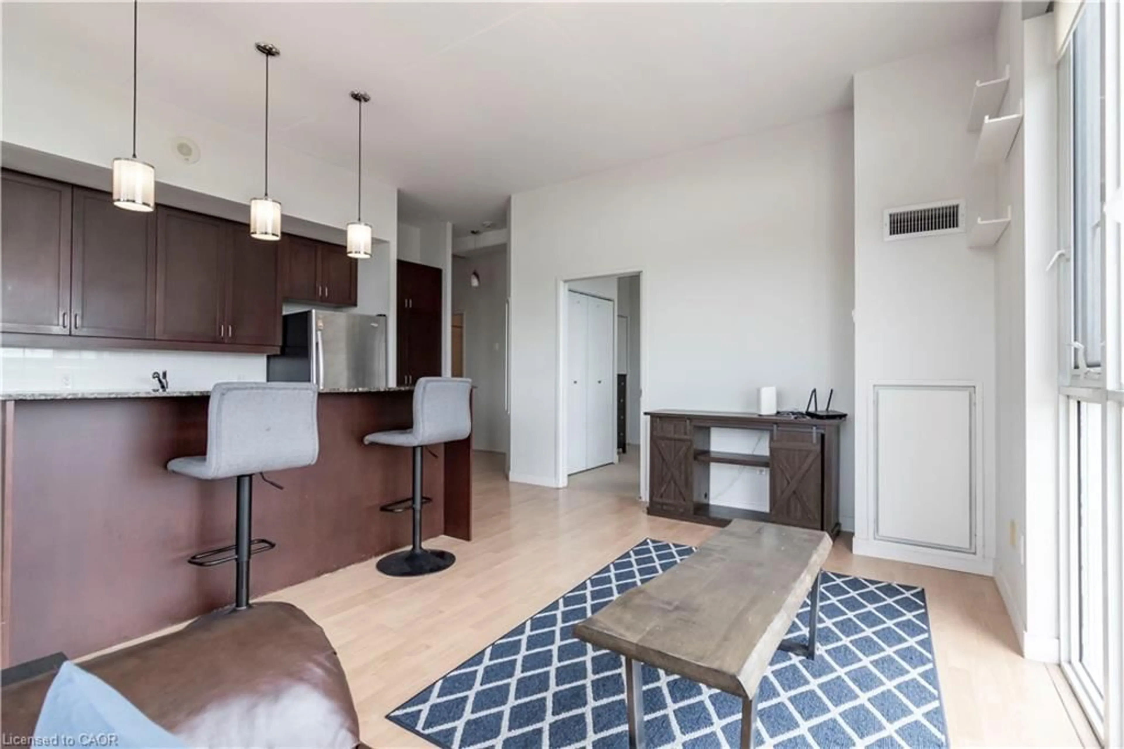 Open concept kitchen, wood/laminate floor for 191 King St #506, Waterloo Ontario N2J 1R1