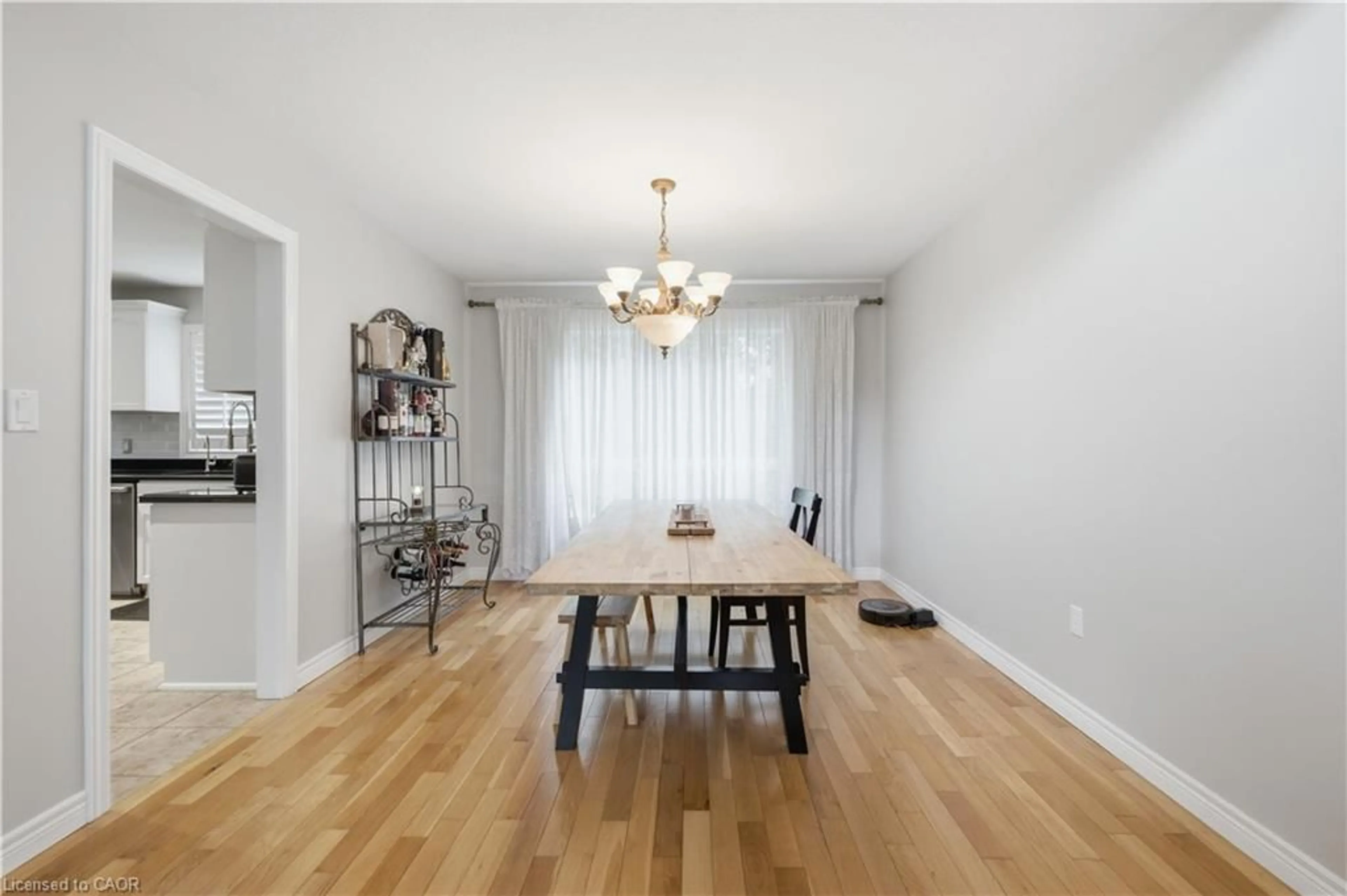 Dining room, wood/laminate floor for 11 Maynard St, Hamilton Ontario L9B 1A9