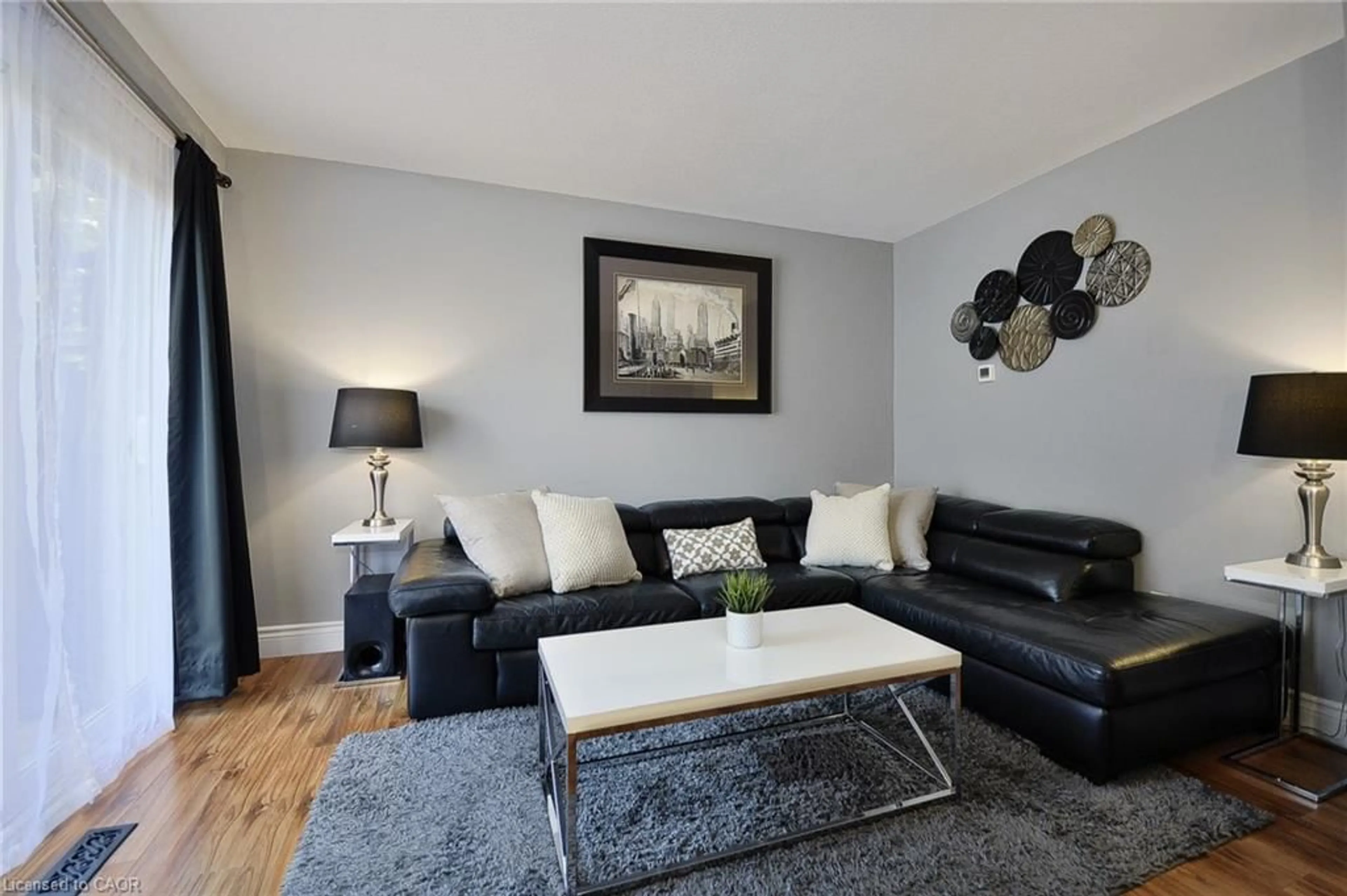 Living room with furniture, wood/laminate floor for 43 Thaler Ave #15, Kitchener Ontario N2A 1R3