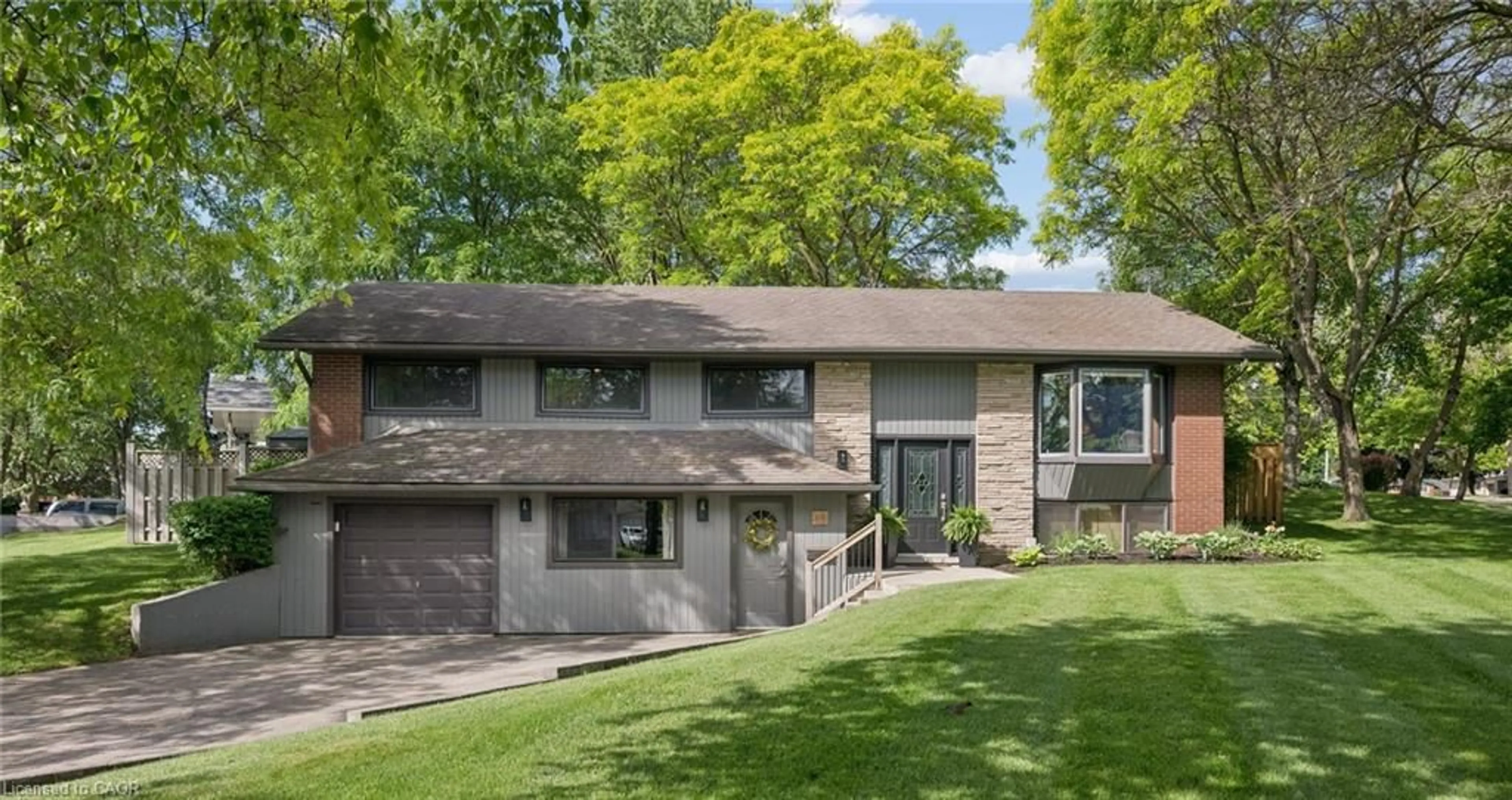Home with brick exterior material, street for 65 Gilmour Cres, Kitchener Ontario N2M 4N5
