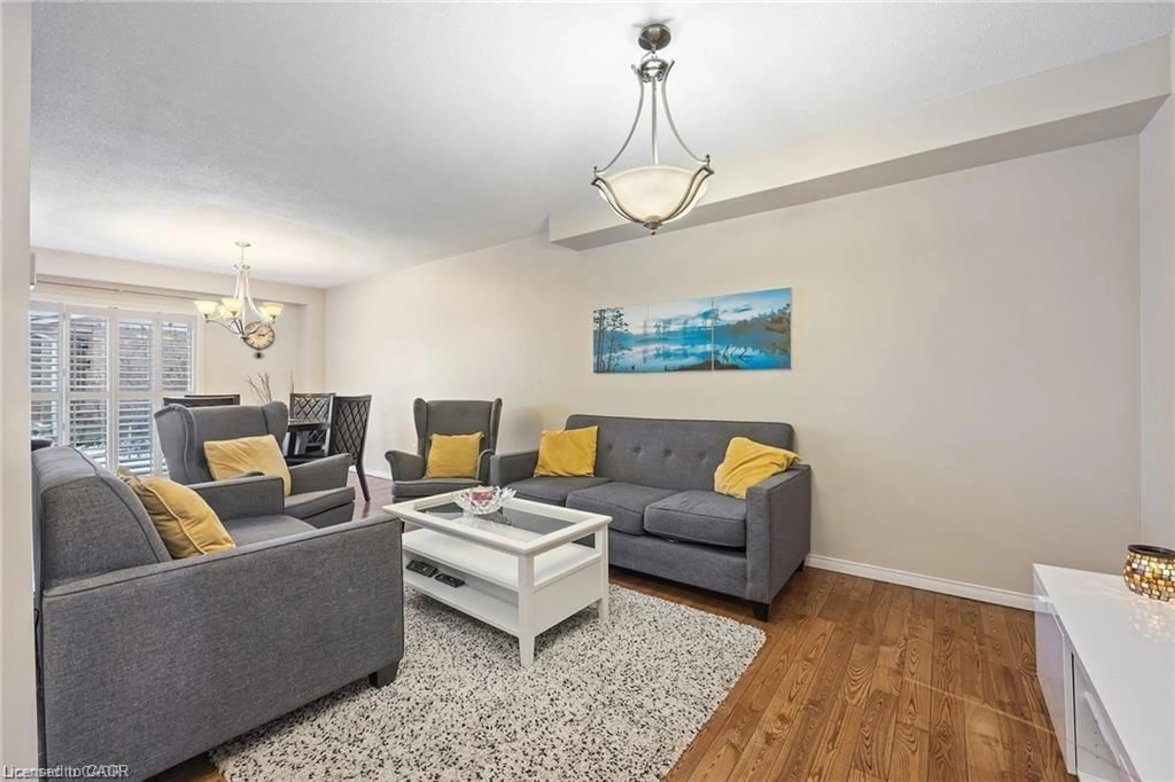 Living room with furniture, wood/laminate floor for 125 Terni Blvd, Hamilton Ontario L8W 3W4
