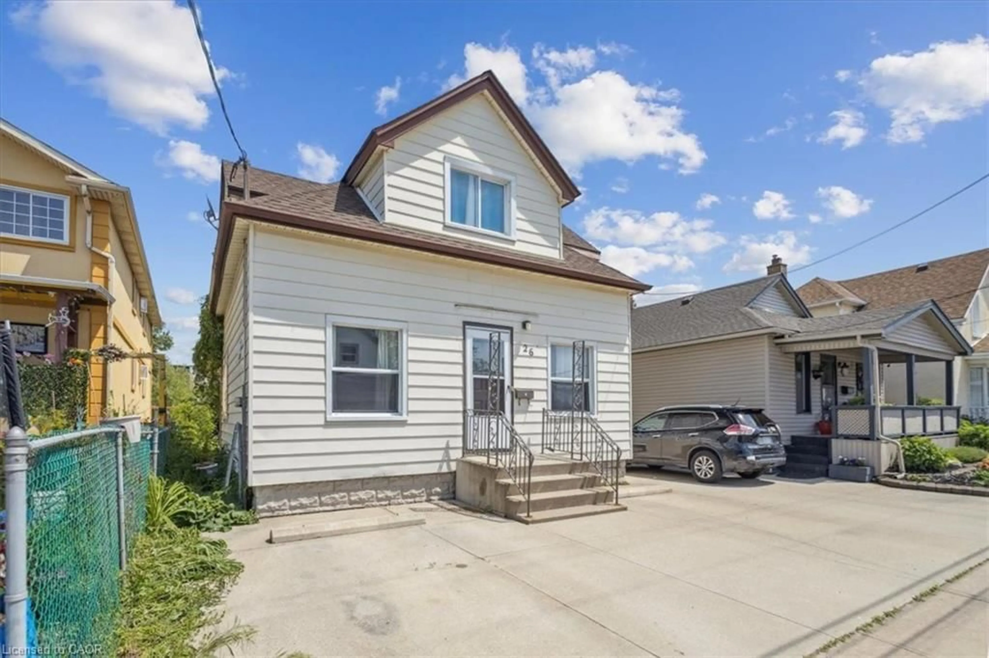 Home with vinyl exterior material, street for 26 Vine St, St. Catharines Ontario L2R 3X8