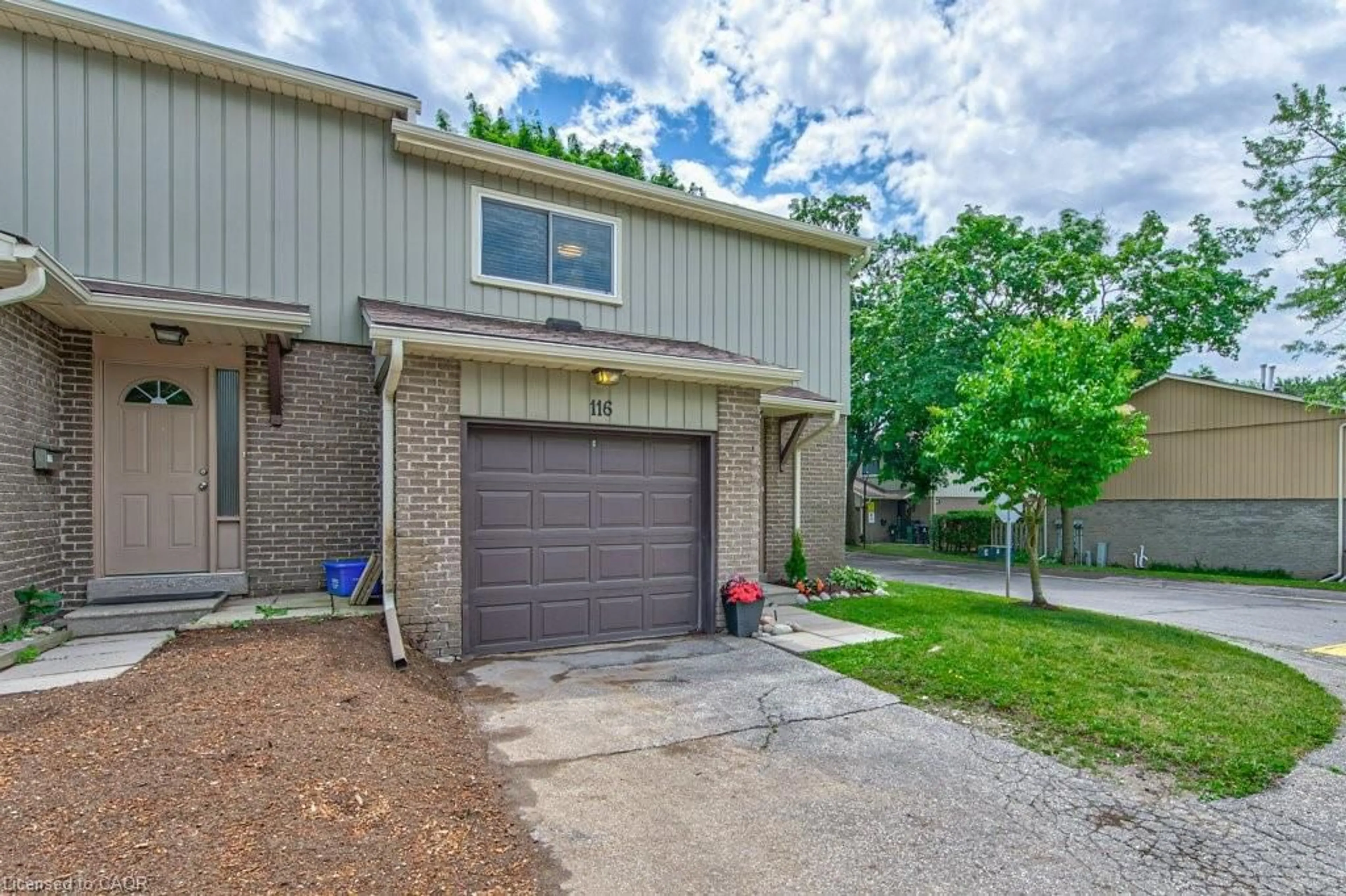 Home with brick exterior material, street for 51 Paulander Dr #116, Kitchener Ontario N2M 5E5