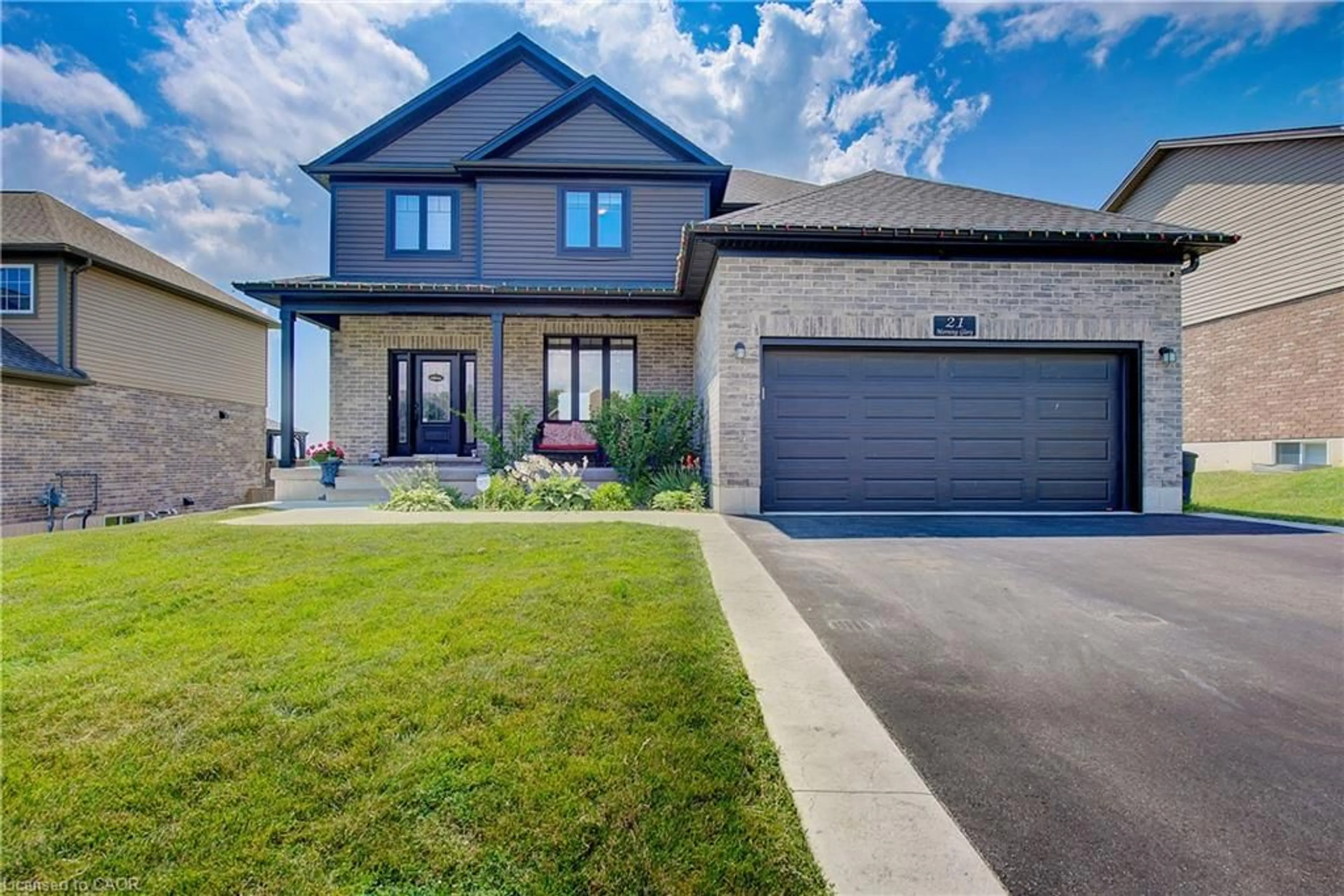 Home with brick exterior material, street for 21 Morning Glory Dr, Tillsonburg Ontario N4G 5S9